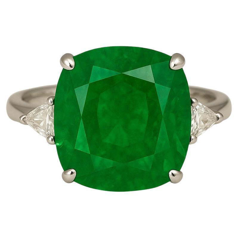 A rare and majestic creation by Antinori di Sanpietro, this spectacular ring showcases a 14.11 carat cushion-cut Zambian emerald, certified by GRS and classified as Minor Oil — a highly desirable level of enhancement for fine emeralds. This