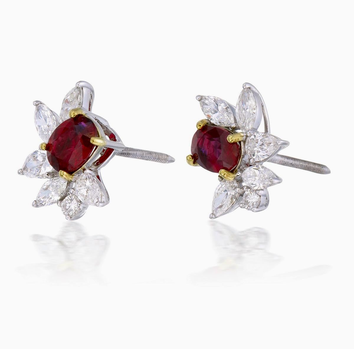 A pair of fine timeless ruby and diamond earrings made in 18 Karat gold. This pair of earrings embraces minimalism with its simple design while still displaying elegance; a great fit for lifestyle wear.

- There are two center oval Pigeon Blood