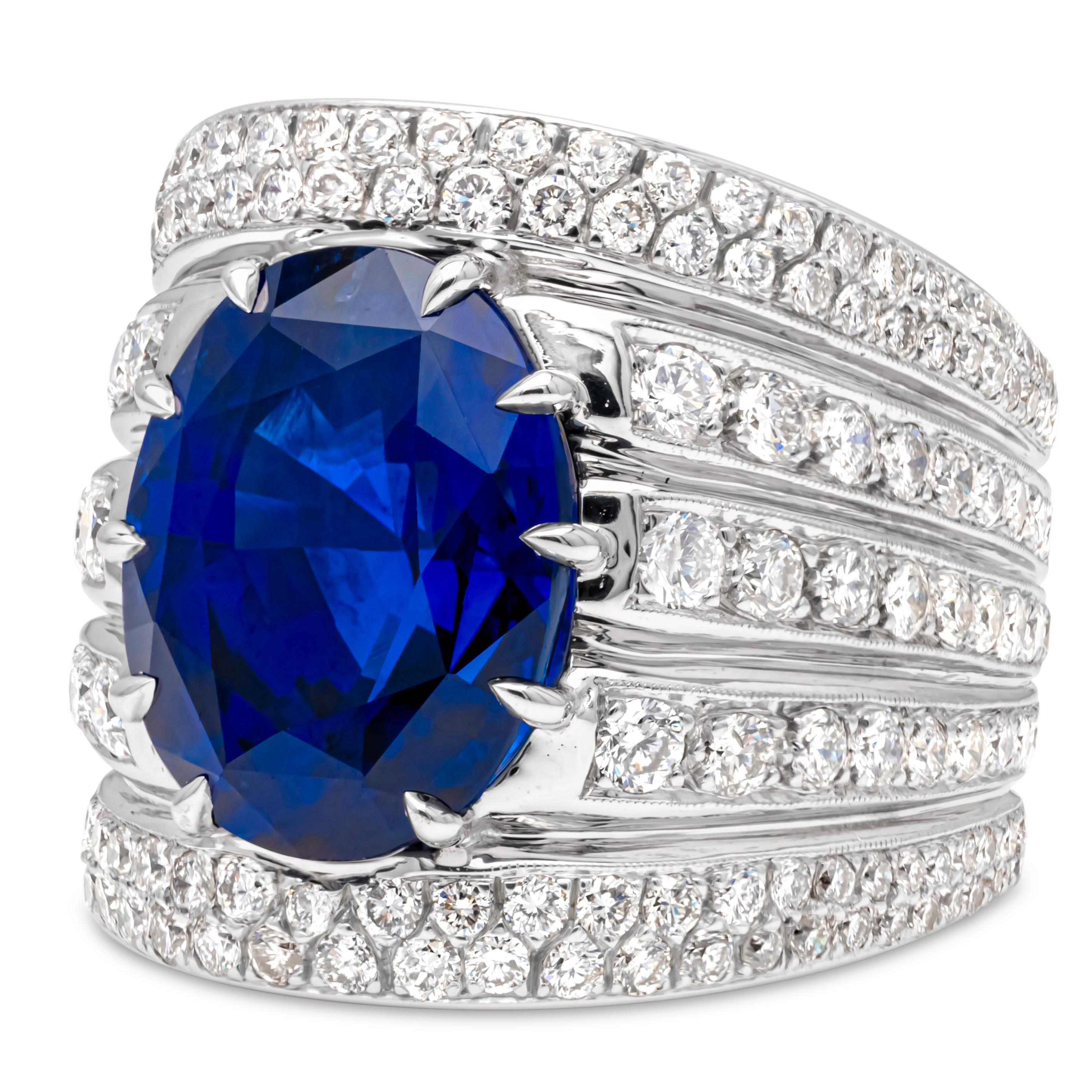 An appealing and charming cocktail fashion ring showcasing a single oval cut Sri Lanka royal vivid blue sapphire weighing 15.27 carats total, Set in a beautiful wide band accented with five rows of 176 brilliant round cut diamonds weighing 3.25