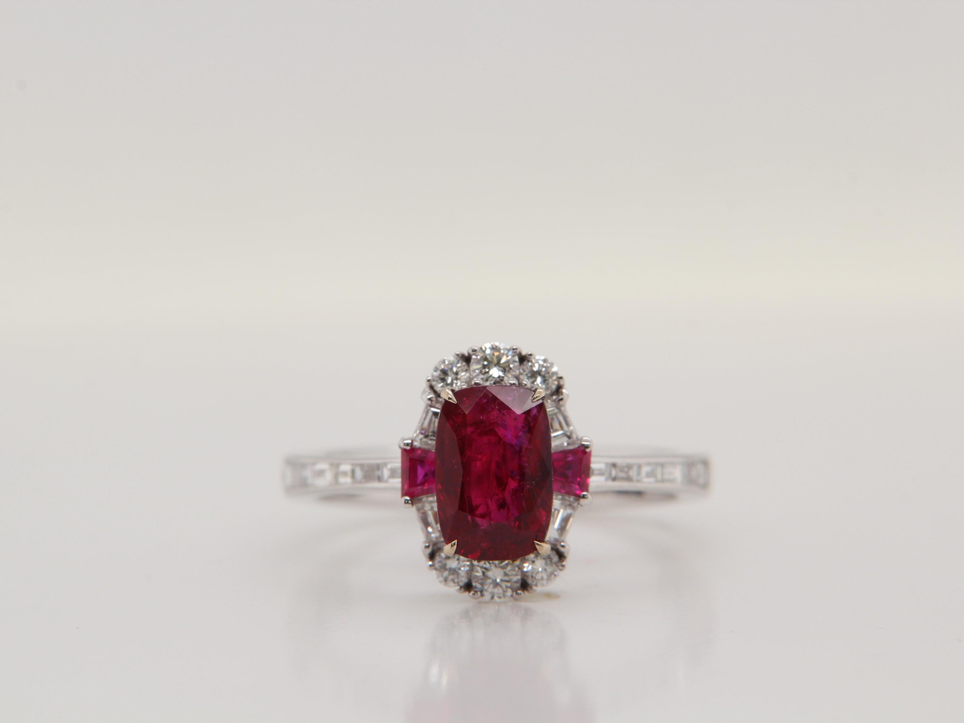 A brand new ruby and diamond ring made with 18K gold. Following a classic design, the ring has a rare vivid red Burmese ruby that helps the wearer feel important. The ruby weighs 1.56ct and is certified by Gem Research Swisslab (GRS) as natural, no