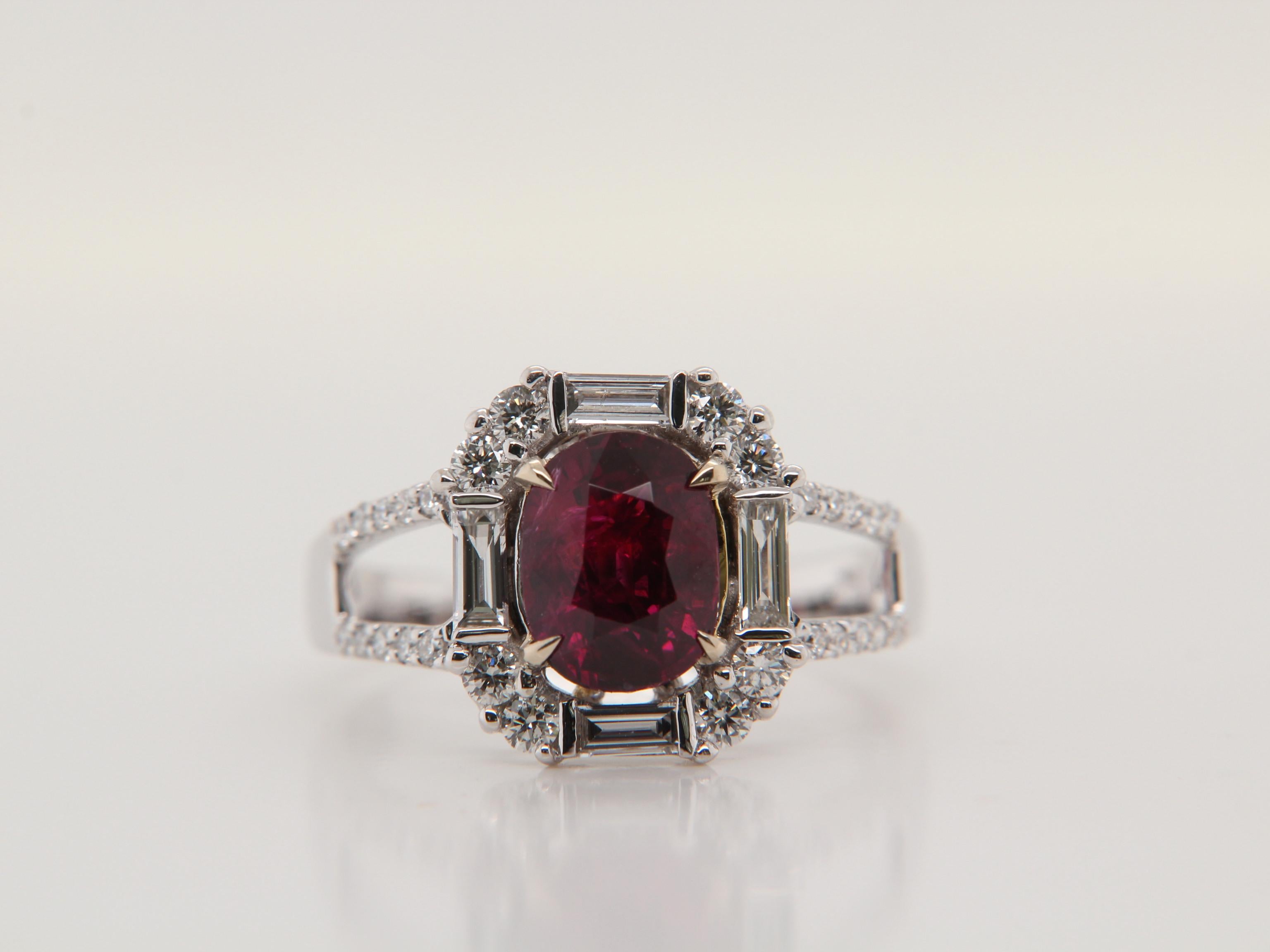 A brand new Burmese ruby and diamond ring by Rewa Jewelry. The mounting is handmade in 18 Karat white gold and set with a 1.63 Carat ruby in the center. The ruby is certified by Gem Research Swisslab as natural, 'Red', and without any heat