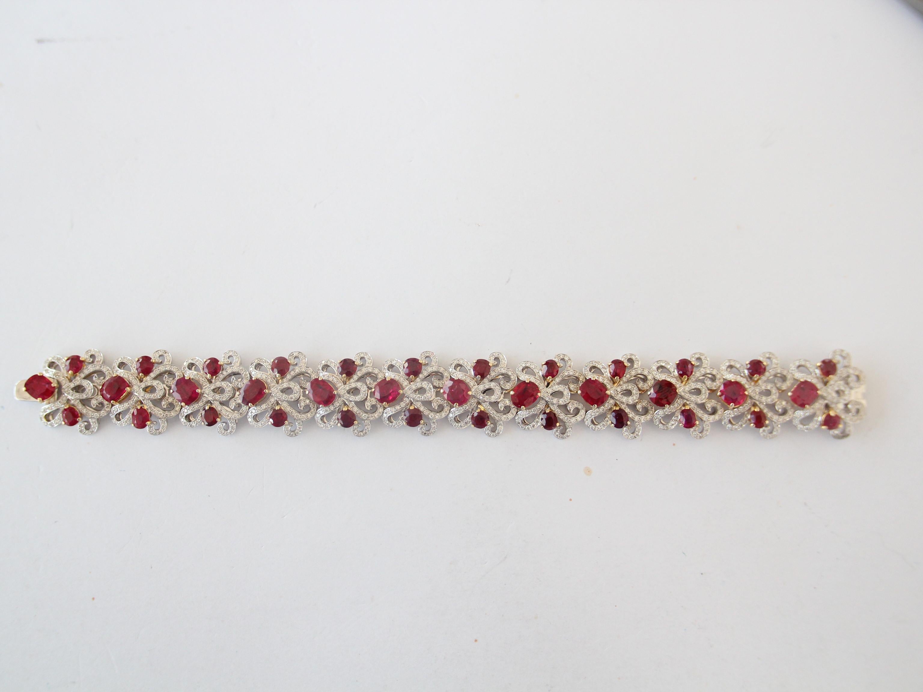 A brand new hand made bracelet by Rewa made with natural Burmese rubies and diamonds, in 18 Karat white gold. One ruby of weight 0.99 carat is certified GRS Pigeon Blood Burmese No heat, the rest of the rubies have not been tested. The total ruby