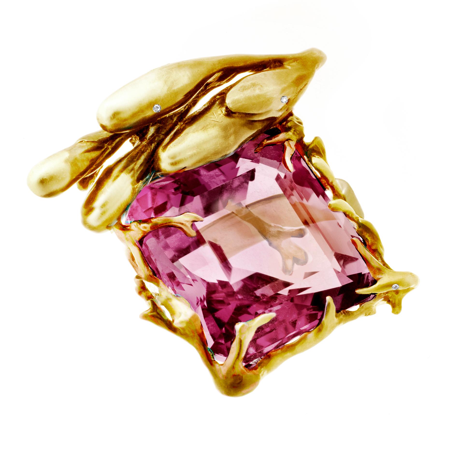 The center of this 18 karat yellow gold Fairy Tale engagement ring is a 17.03-carat GRS certified pink Burma spinel. The dimensions of the gem are 17.66 x 13.92 x 7.35 mm.

The spinel has an exquisite liquid light play on its surface, which is