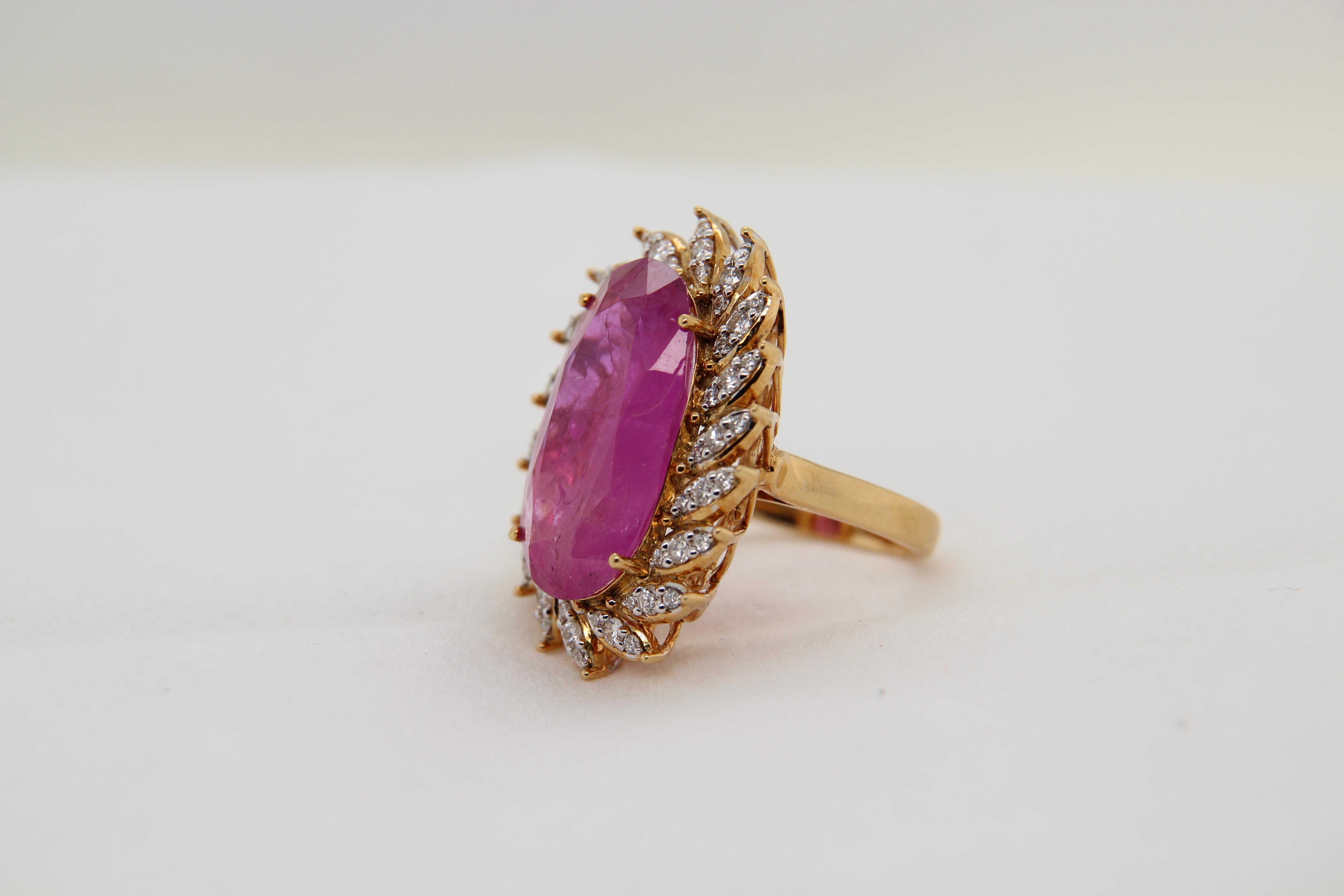 A new GRS certified Heated Burmese pink sapphire ring made in 18 Karat gold. The total ruby weight is 17.58 carats, the total diamond weight is 0.74 carats, and the total ring weighs 13.14 grams. This ring is resizable. 
