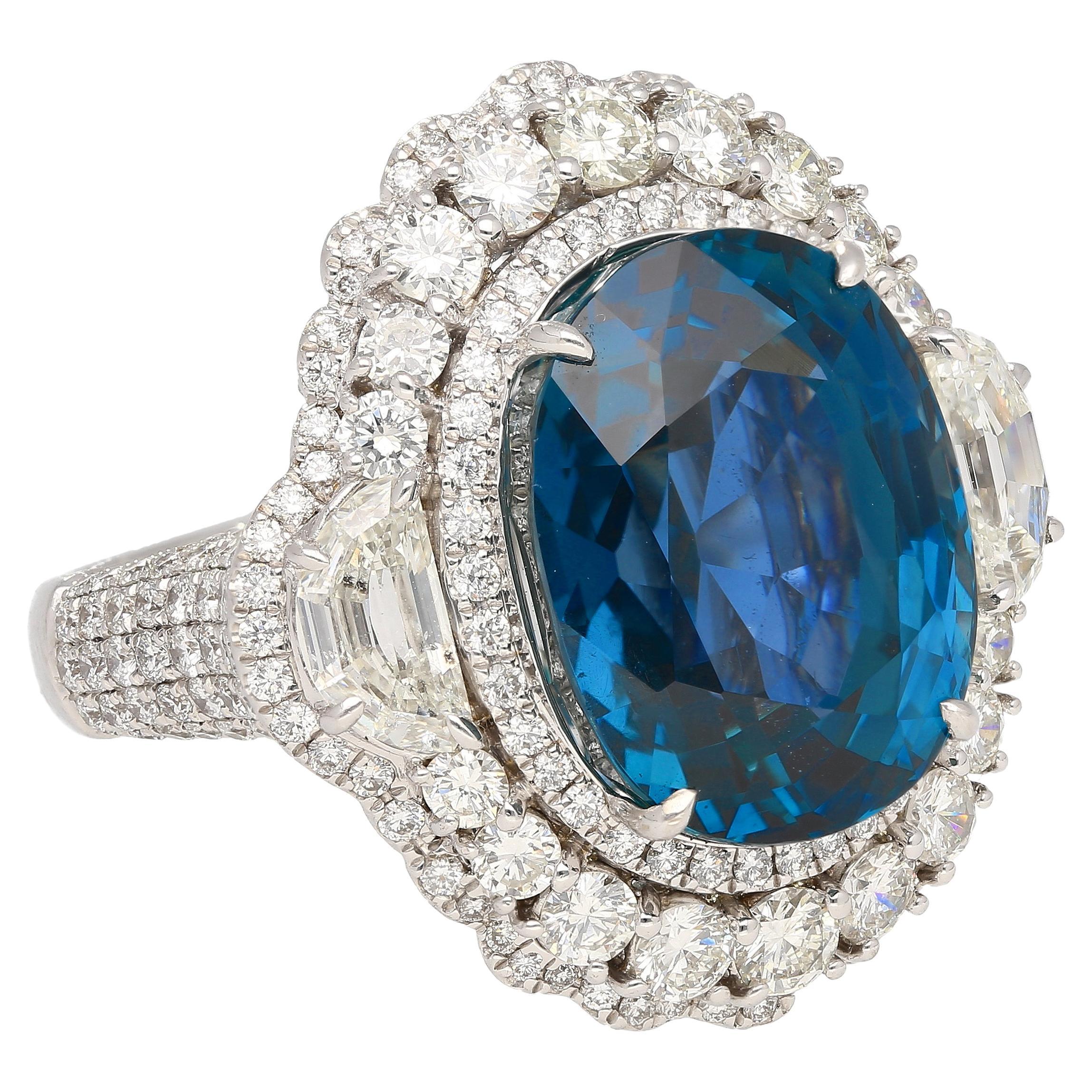 18K White Gold Ring, meticulously crafted with a prong setting to showcase its exquisite centerpiece – an 18.16-carat Burmese Sapphire, originating from the prestigious Mogok Pain Pyit region. This oval-cut Blue Sapphire bears no heat treatment or