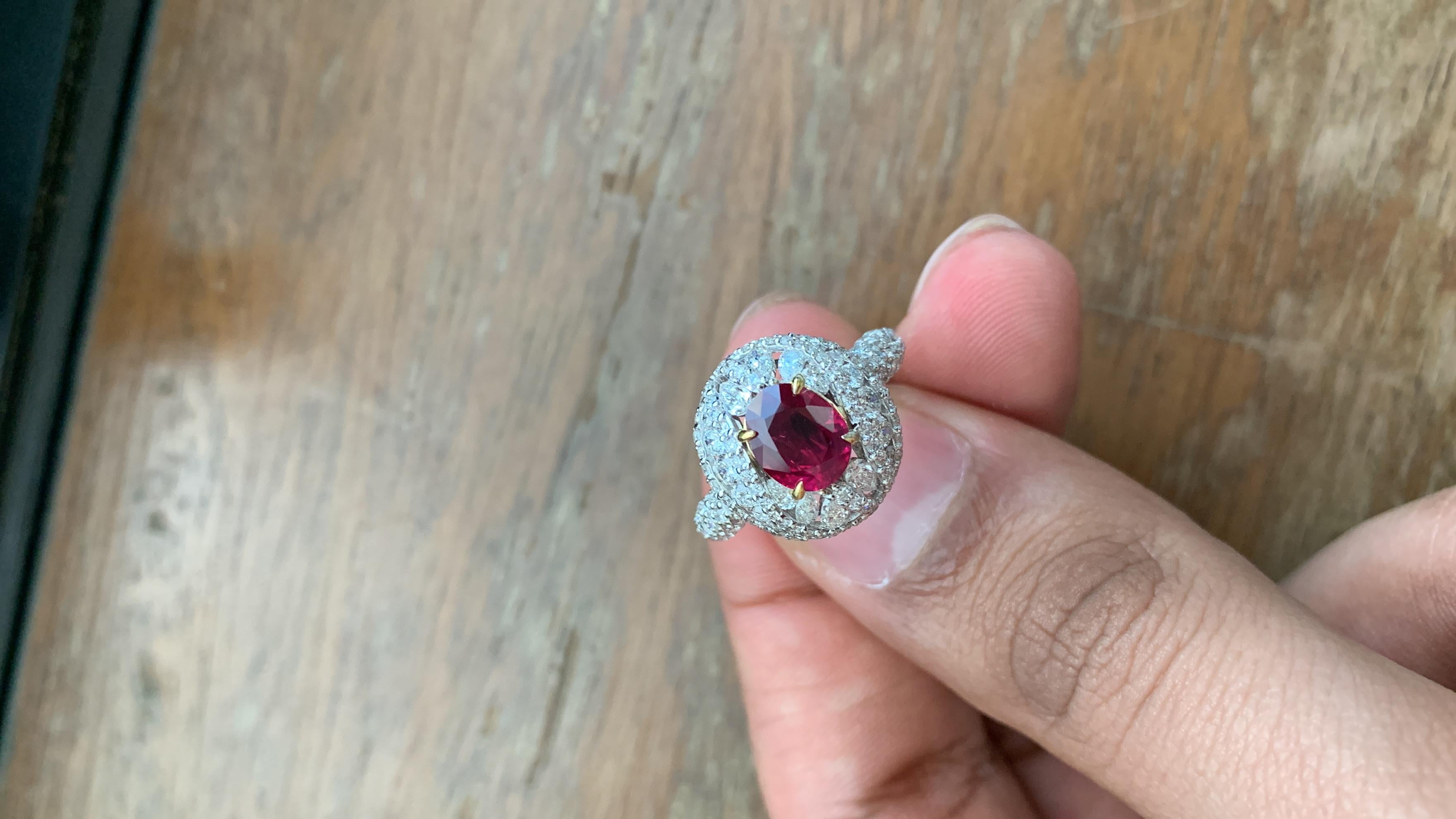 A brand new handcrafted ruby ring by Rewa Jewels. The ring's center stone is 1.83 carat Burmese ruby certified by Gem Research Swisslab (GRS) as natural, unheated, 'Pigeon blood' with the certificate number: 2022-060406. The centre ruby has been set