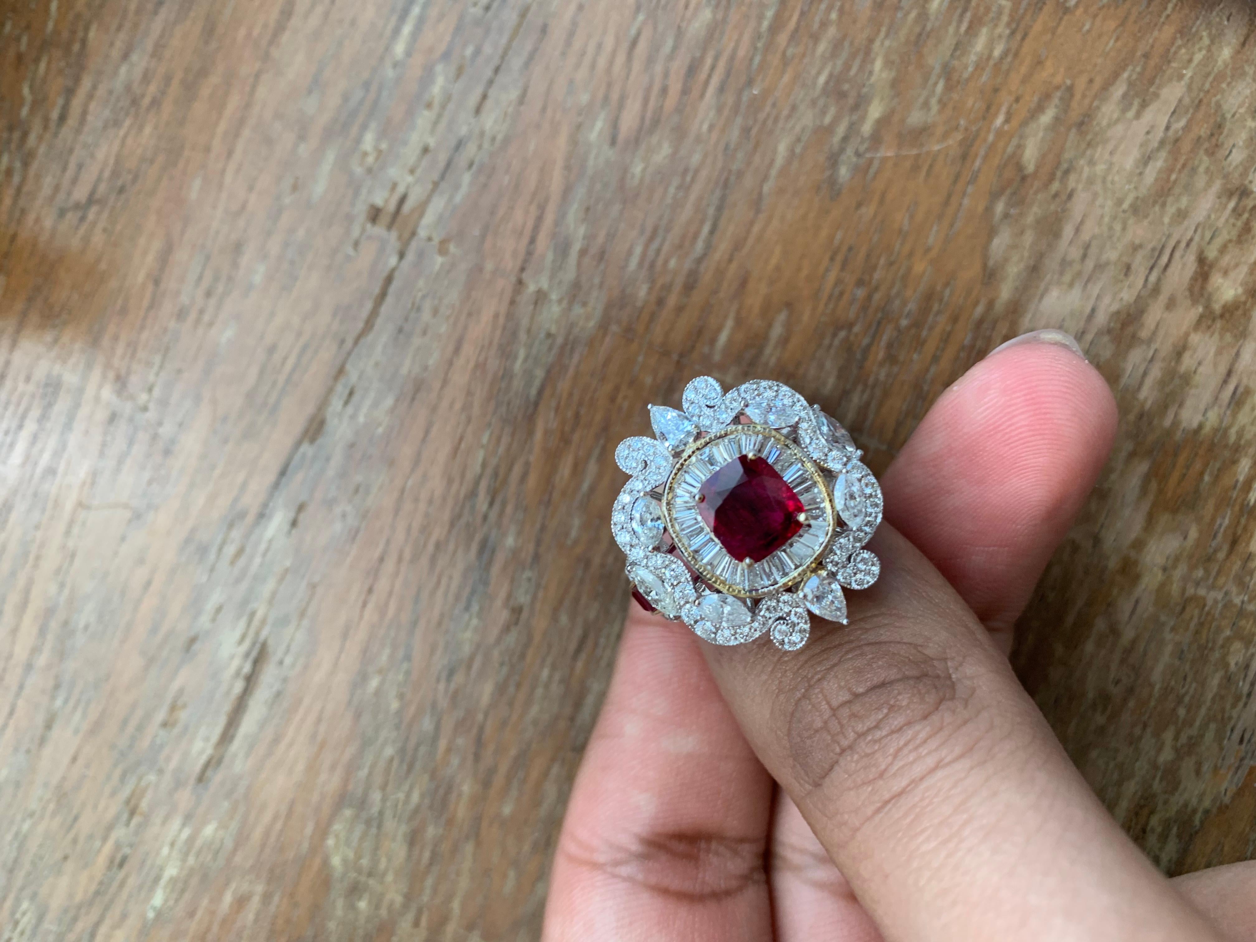A brand new handcrafted ruby ring by Rewa Jewels. The ring's center stone is 1.83 carat Burmese ruby certified by Gem Research Swisslab (GRS) as natural, unheated, 'Pigeon blood' with the certificate number: 2022-060412. The centre ruby has been set