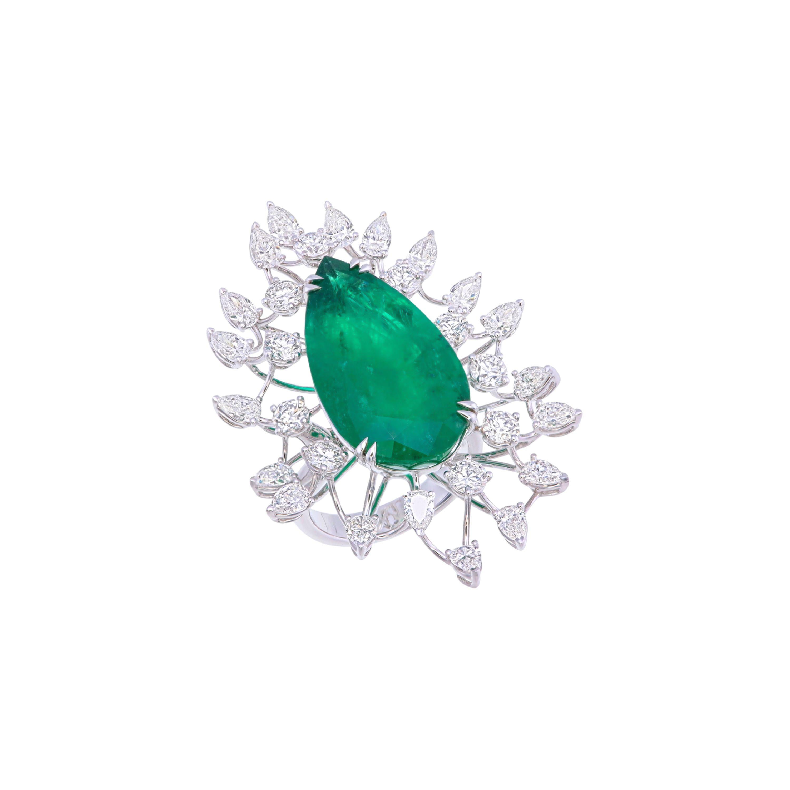 This stunning 18K white gold ring features a striking pear-shaped emerald at its center, weighing an impressive 19.62 carats. The rich green hue of the emerald captivates the eye, enhanced by its exquisite size. It is certified by GRS - GemResearch