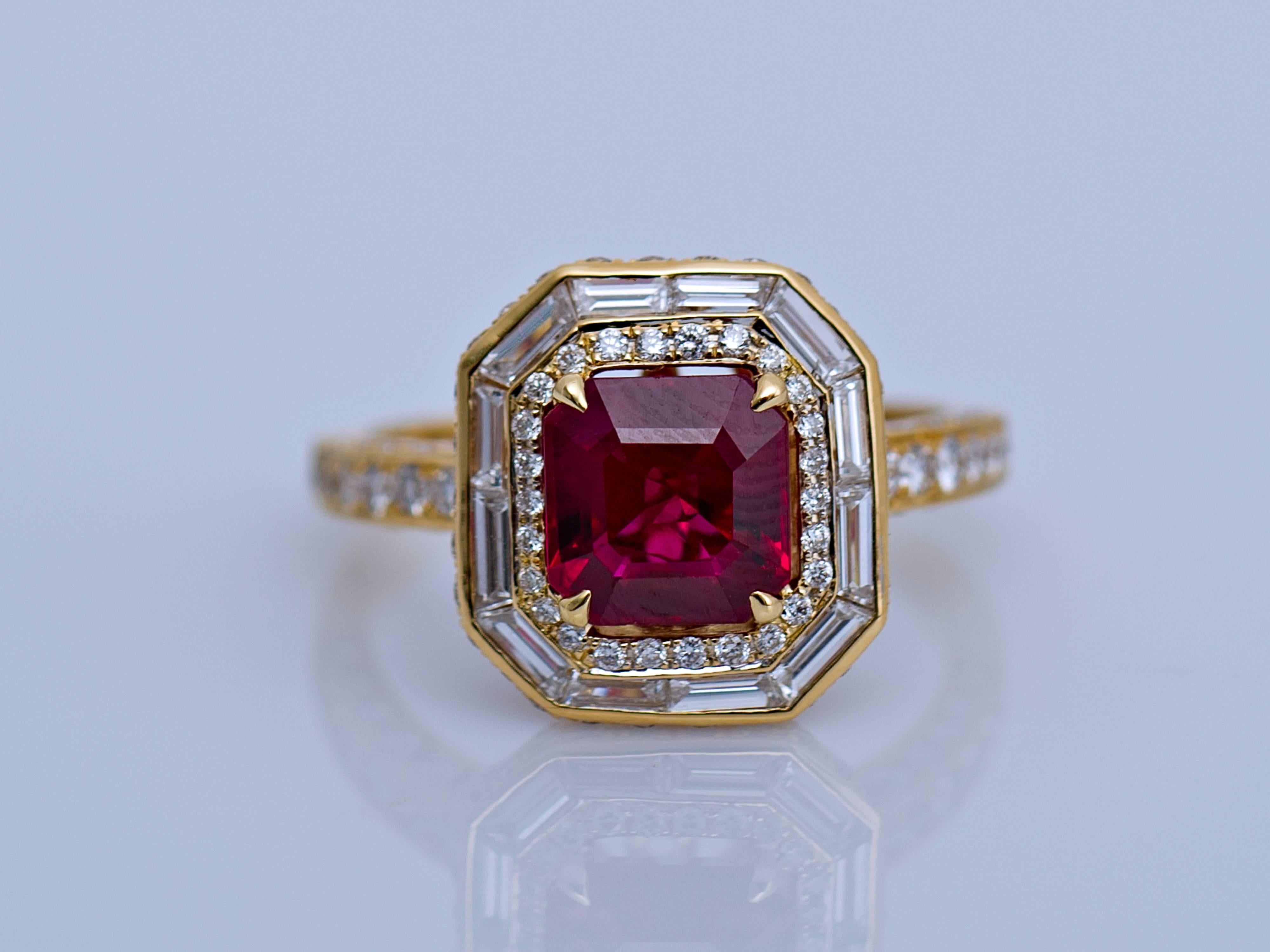 The octogonal Shaped 'Pigeon Blood' Ruby weighing 1.98 Carats set in the centre of the ring, bordered by small pavé-set diamonds and baguette shaped diamonds. The ring is crafted in 18k yellow gold and is surrounded by over 100 diamonds.

Purchase