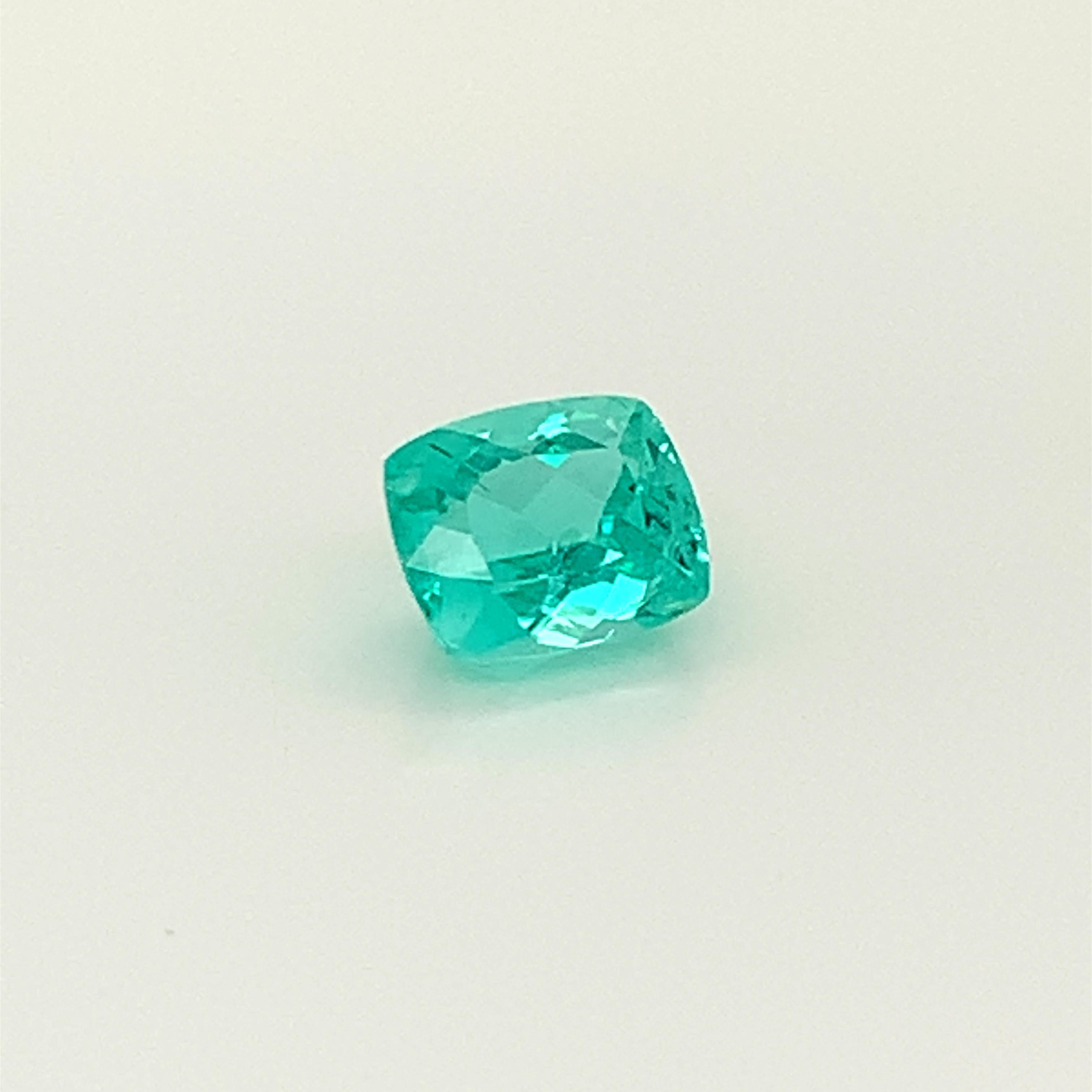 Paraiba Tourmaline cushion cut stone weighing a total of 1,99 Carats, offered loose to create an unique design.
its certificate says that it comes from Mozambique.
Dimension : 7.99 x 6.67 x 4.82
The stone is shiny with a vibrant green blue color.


