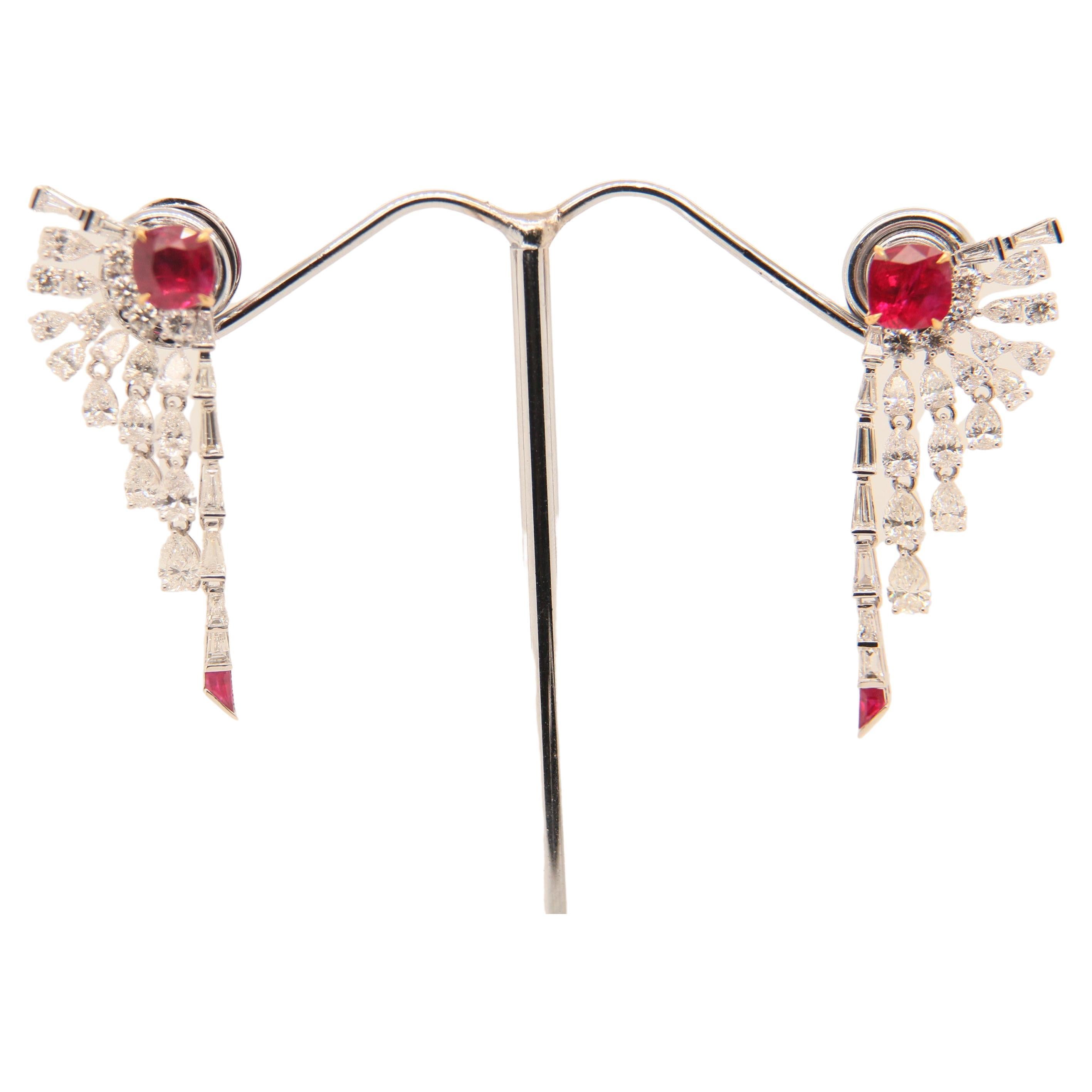 A classic pair of vibrant and rare Burmese ruby and diamond earrings. The ruby's shining luster is complimented by the sparkling diamonds, this showcases the elegance of the piece . This classic and fun piece will not only help to exude confidence