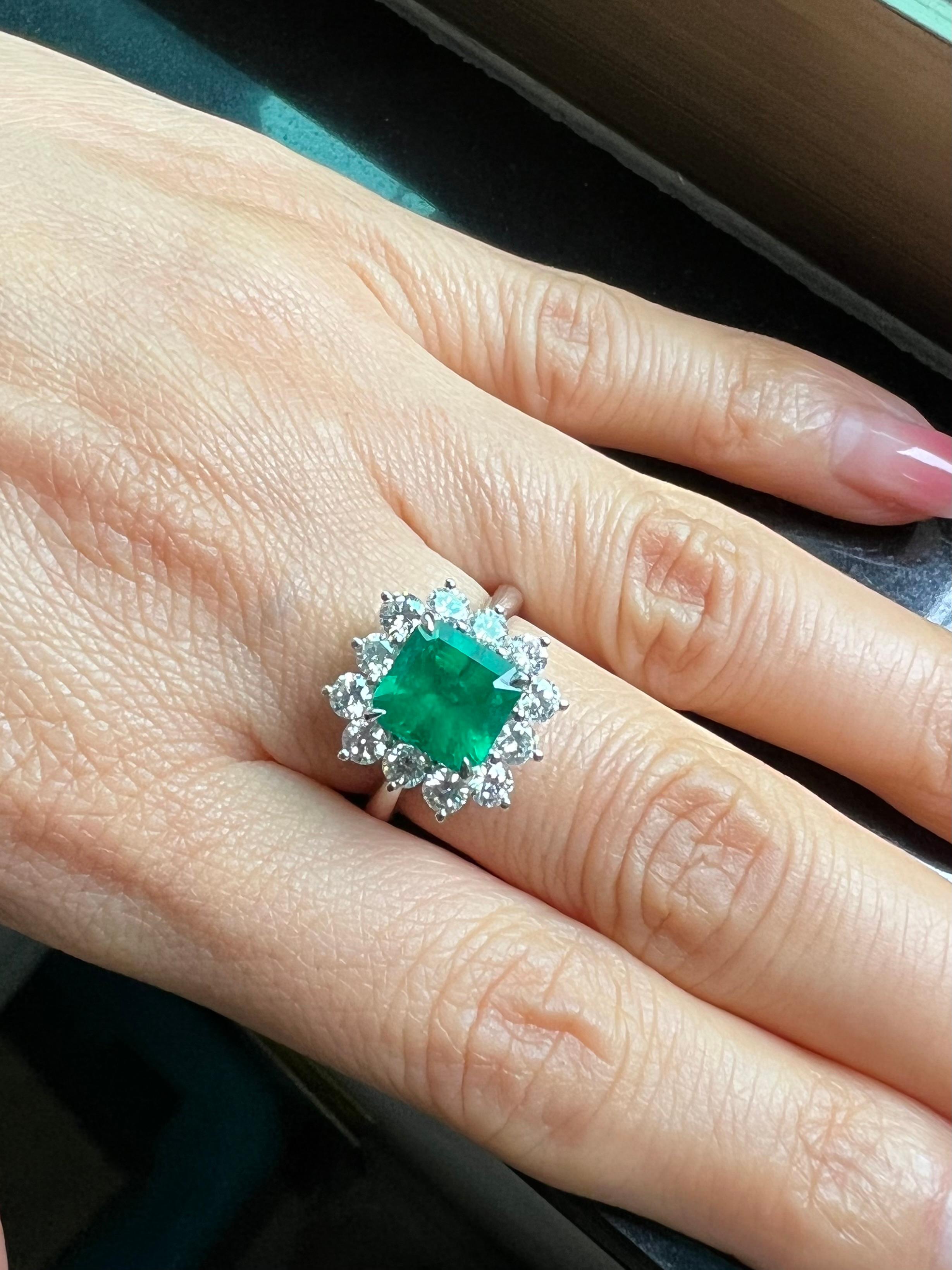 2 carat emerald ring on hand