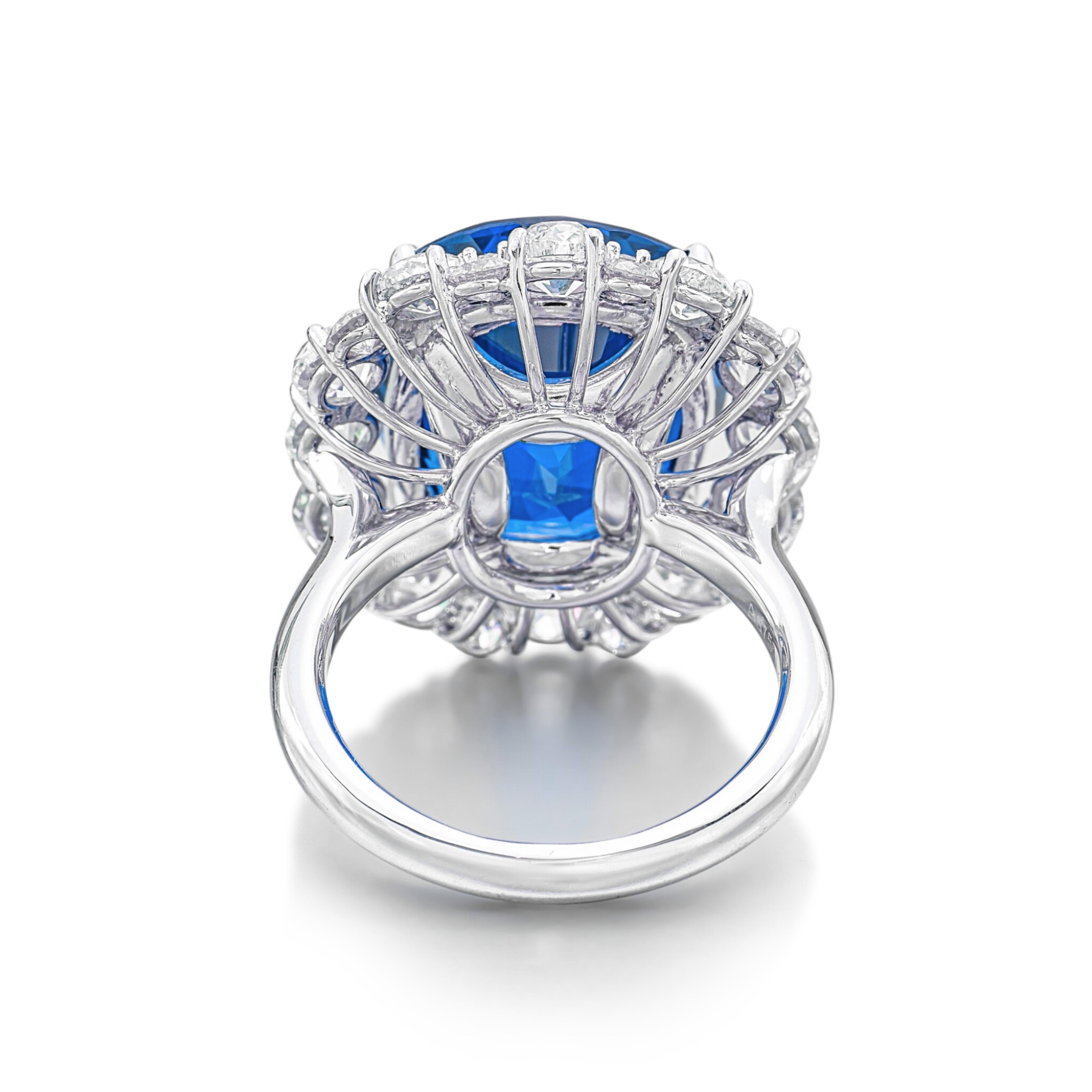 an extraordinary piece featuring a stunning 20-carat oval blue sapphire, beautifully set in platinum. This captivating sapphire, certified by GRS, is known for its exceptional quality as a Ceylon sapphire that has not been heat-treated, ensuring its