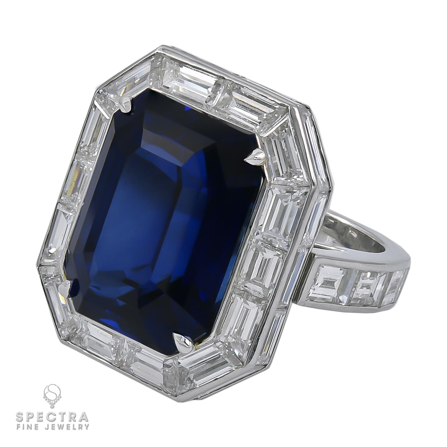 A statement ring featuring a 20.12 carat emerald-cut Royal Blue Sapphire and 34 baguette shape diamonds. 
The sapphire is certified by the Gemresearch Swisslab (GRS) stating that it's of Madagascar origin with indications of heating.
The diamonds
