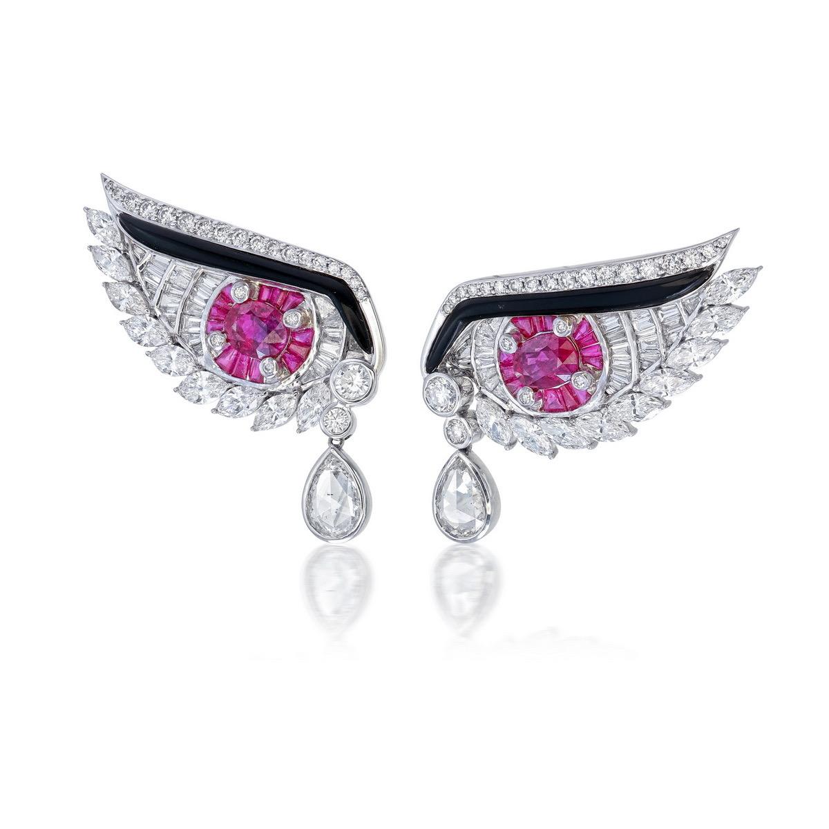 Introducing a stunning pair of earrings from Rewa Jewelry, featuring exquisite 1.03 carat and 1.00 carat rubies each certified as 'Pigeon Blood' by GemResearch Swisslab (GRS), with certificate numbers GRS2021-110706 and 2021-110636.

The earrings