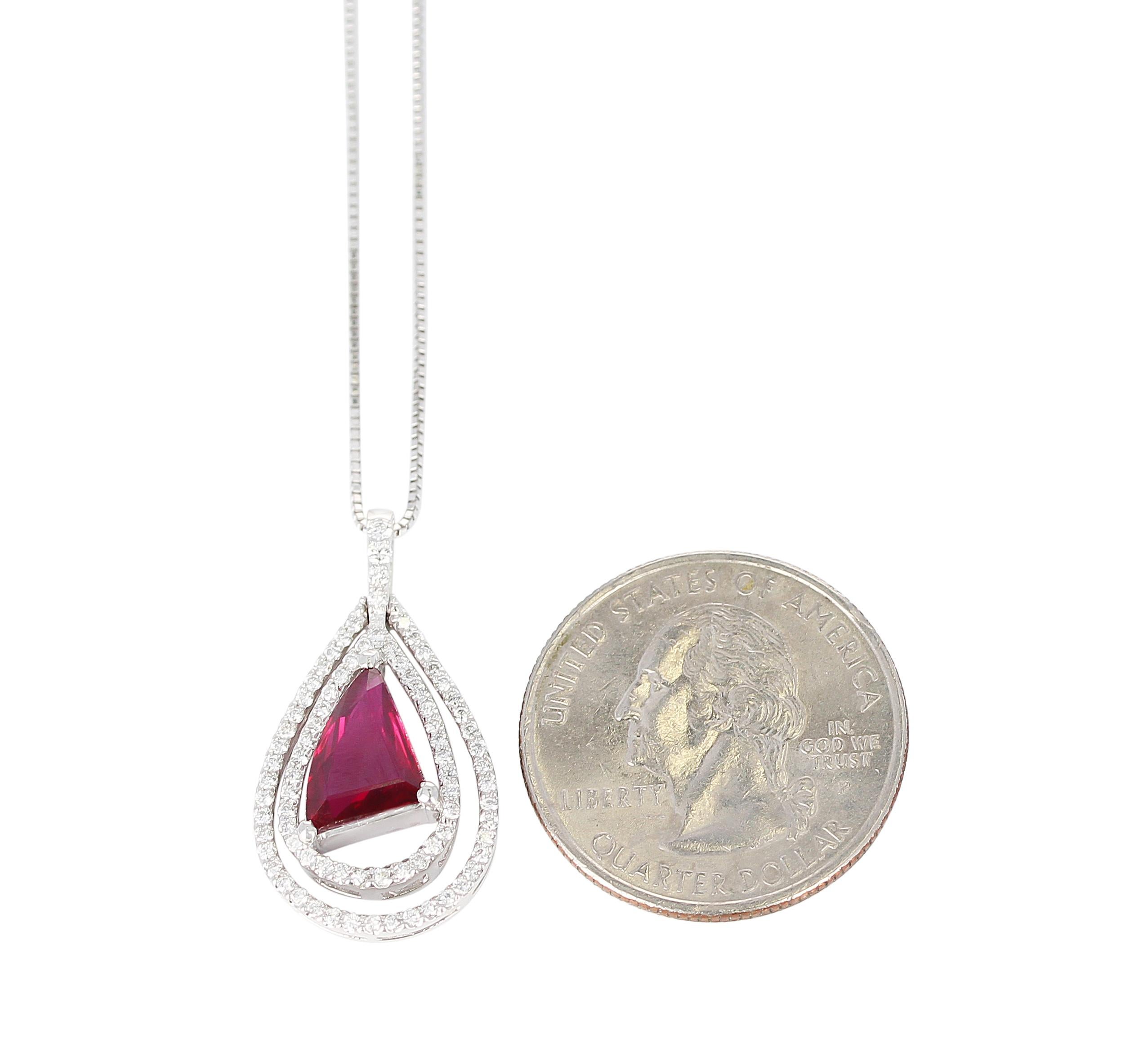 A 2.03 carat No Heat Vivid Red Mozambique Ruby and Diamond Pendant in Platinum.  Diamond Weight: 0.45 carats.  With Chain, Total 6.70 grams. GRS Certificate Available. 
