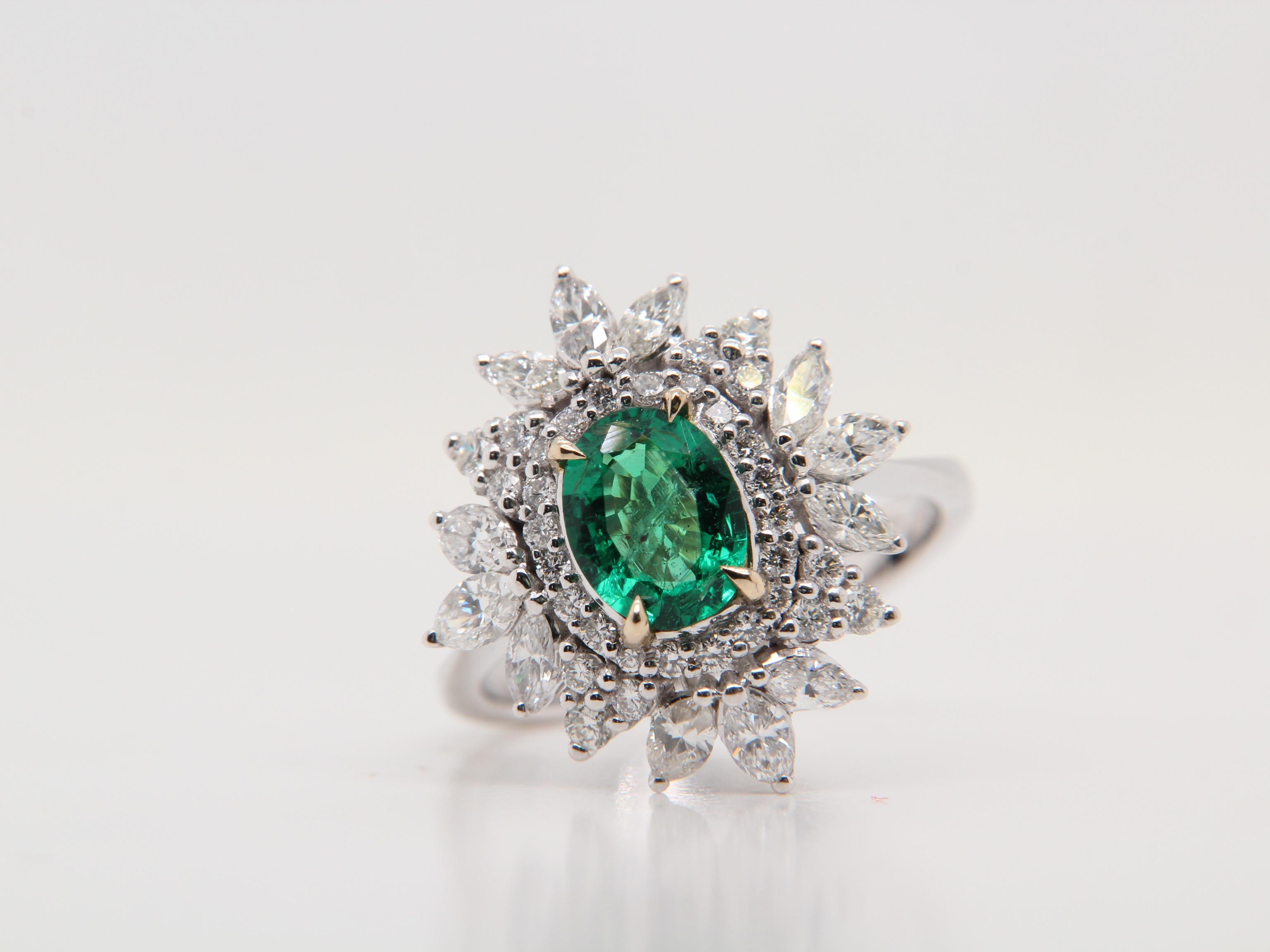 A brand new 1.01 carat emerald ring mounted with diamonds in 18 Karat gold. The total diamond weight is 1.26 carat and the total rings weighs 5.29 grams.