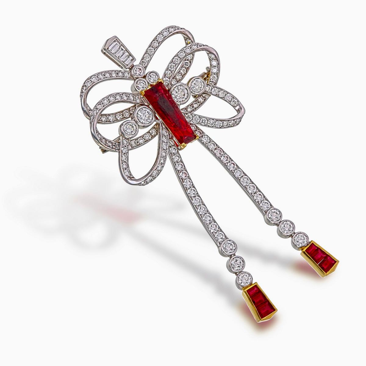 A brand new ruby and diamond pendant by Rewa Jewels. The centre ruby is a 2.12 carat ruby certified by Gem Research Swisslab (GRS) as Burmese, No Heat, and of 'Pigeon Blood' status. The report number is 2022-040195.

There are 6 extra ruby tapered