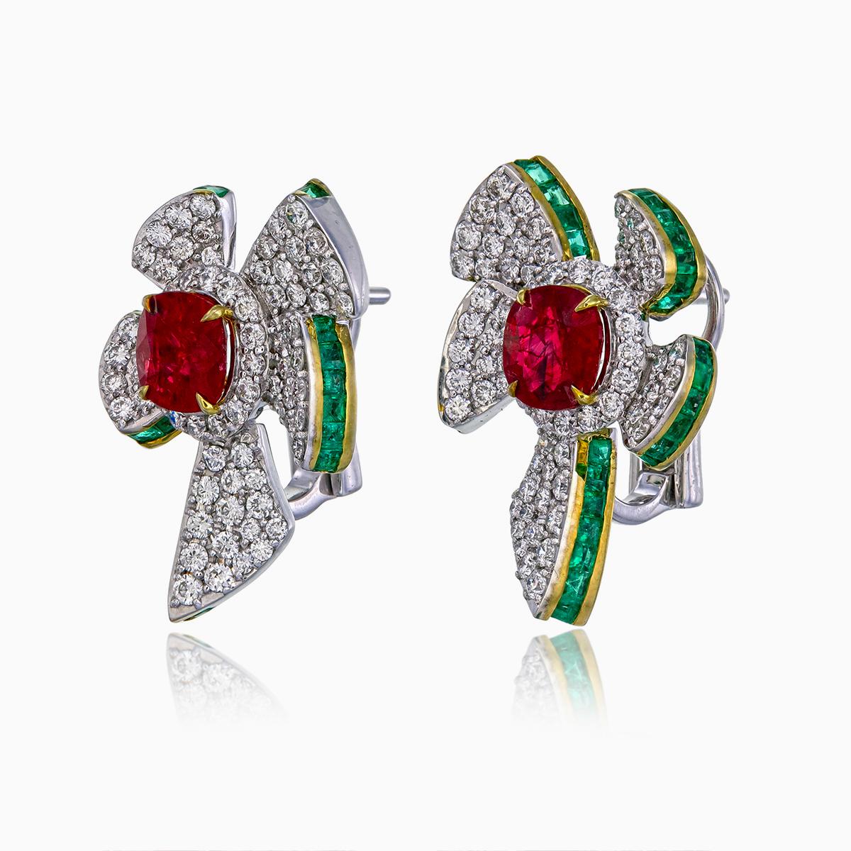 These earrings showcase GRS-certified Pigeon Blood rubies totaling 2.13 carats, with one ruby weighing 1.00 carat (Certificate number GRS2021-072406) and the other 1.13 carats (Certificate number GRS2021-072407). 

Surrounding the rubies are 1.40