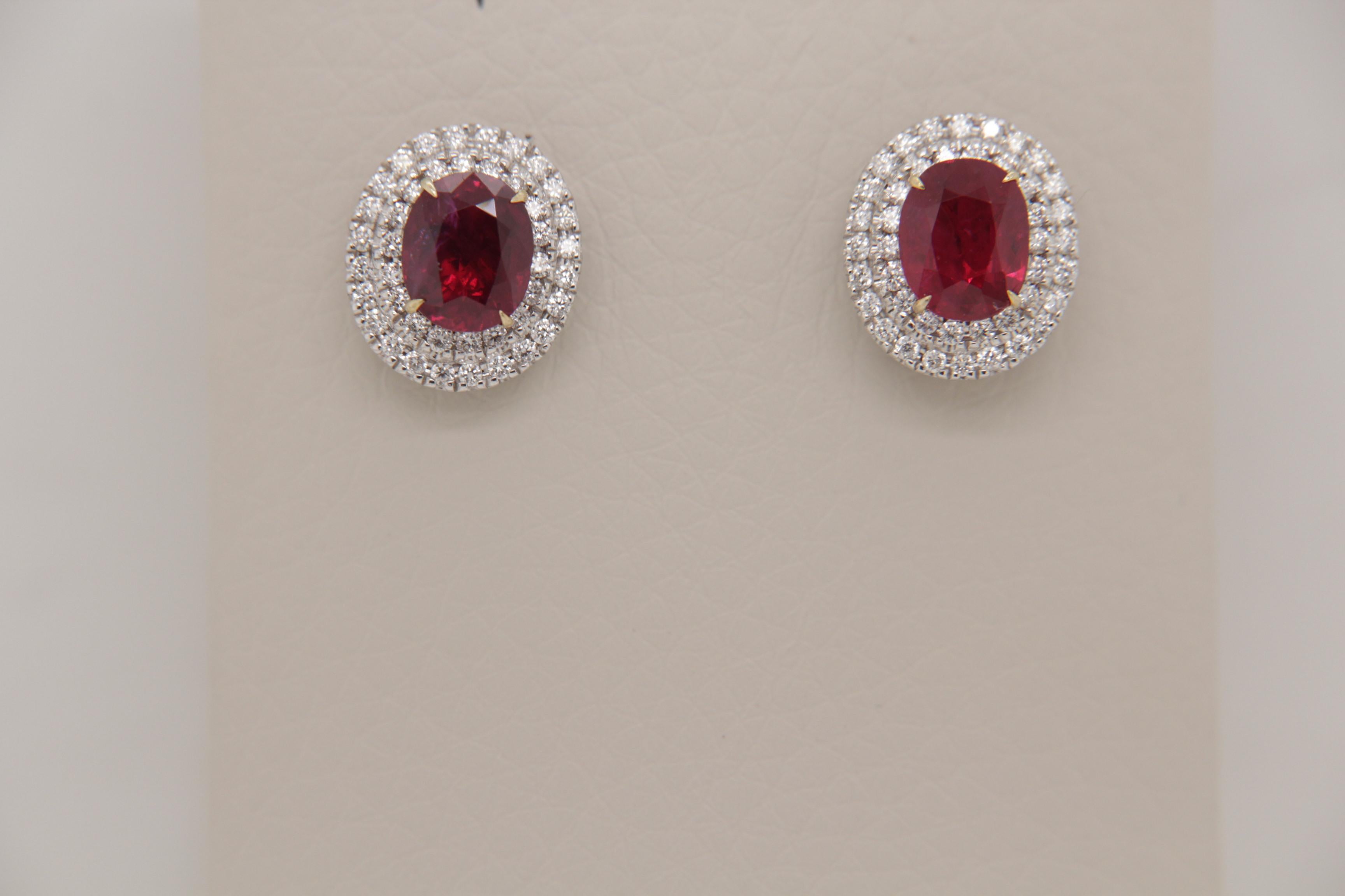 An eye catching pair of vibrant and rare Burmese ruby and diamond earrings. The ruby's shining lustre is complimented by the sparkling diamonds, this showcases the elegance of the piece . This rare piece will not only help to exude confidence and