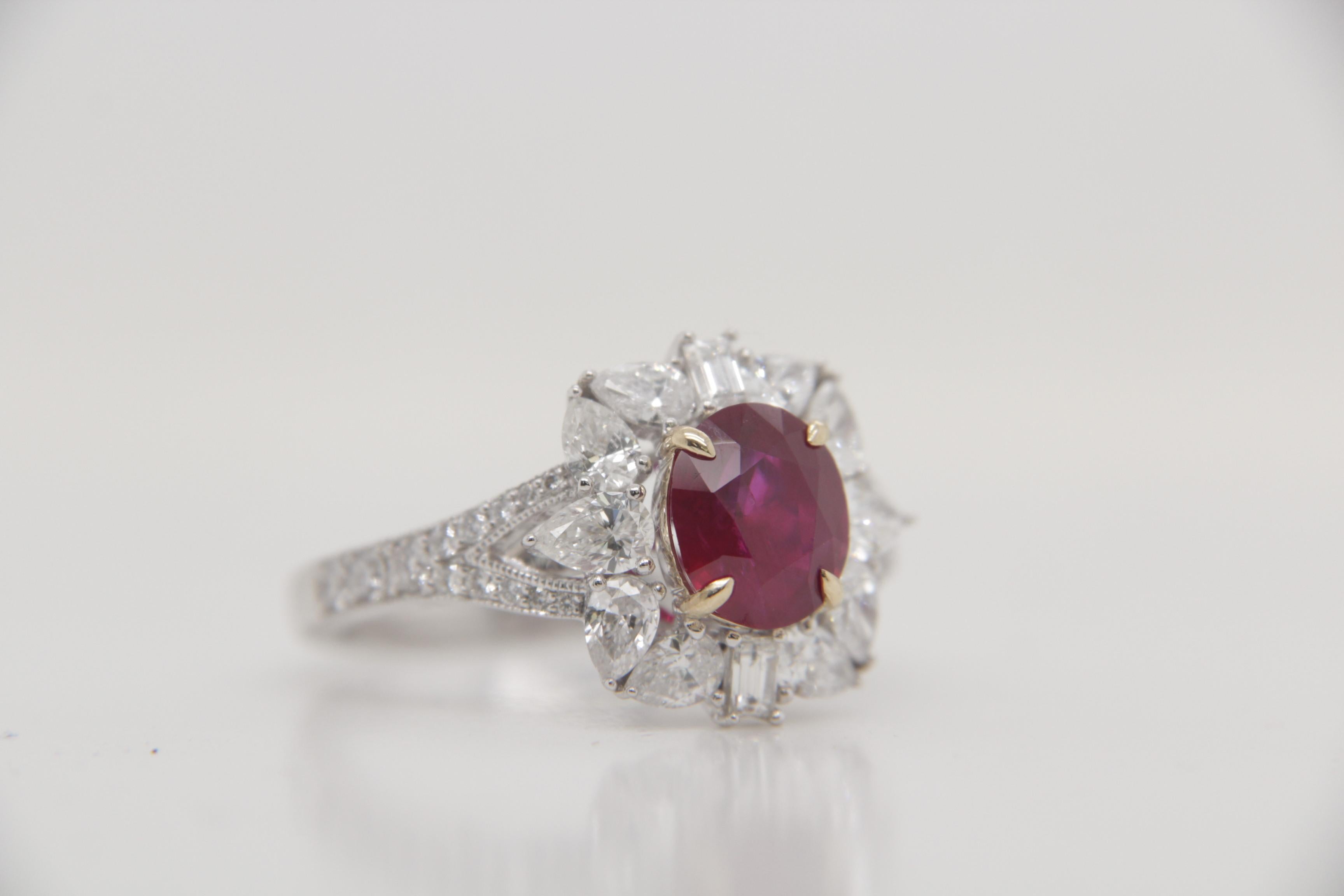 A brand new handcrafted ruby ring by Rewa Jewels. The ring's center stone is 2.18 carat Burmese ruby certified by Gem Research Swisslab (GRS) as natural, unheated, 'Pigeon blood' with the certificate number: 2023-020209. The centre ruby has been set