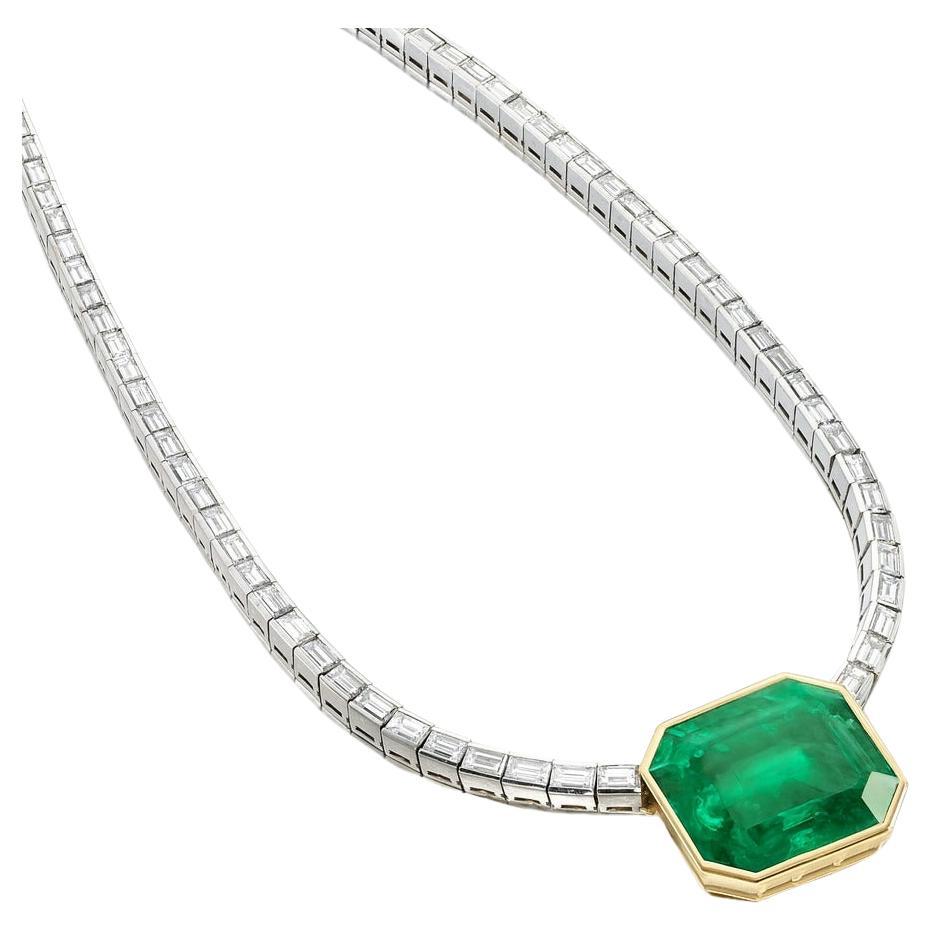 GRS Certified 22.64 Carat Colombian Emerald and Diamond Platinum Necklace

This exquisite articulated necklace showcases a magnificent 22.64 carat Colombian emerald, certified by GRS Switzerland (Report No. GRS2024-087006). The emerald, fashioned in