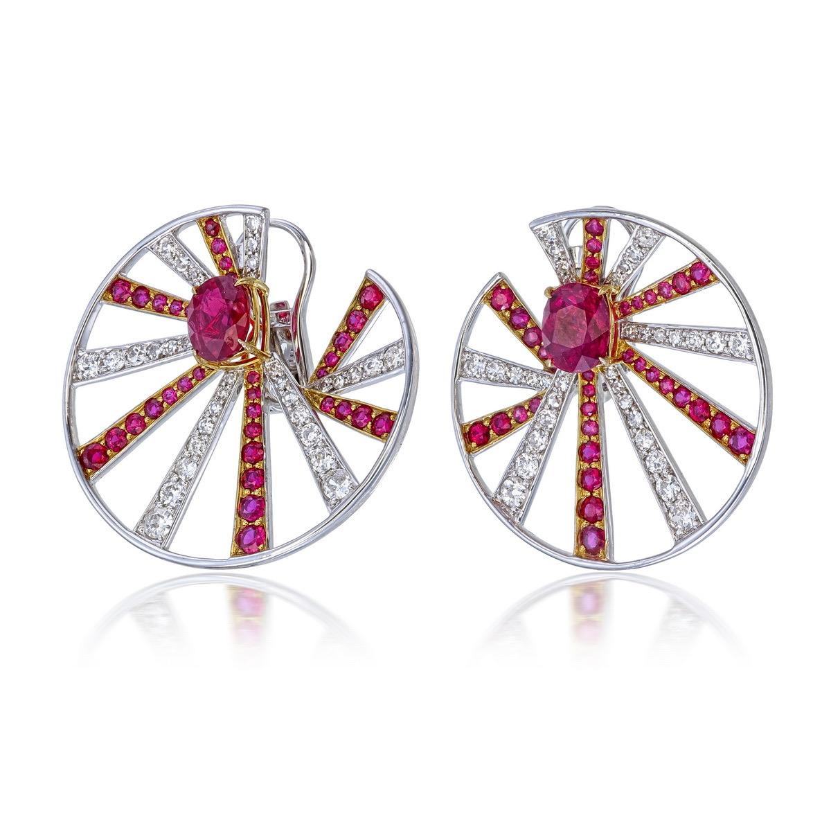 Introducing a stunning pair of earrings featuring no-heat Burma Pigeon Blood rubies at the center, weighing 1.27 carats (GRS2021-102356) and 1.01 carats (GRS2021-102352), certified by GemResearch Swisslab (GRS).

These exceptional center rubies are