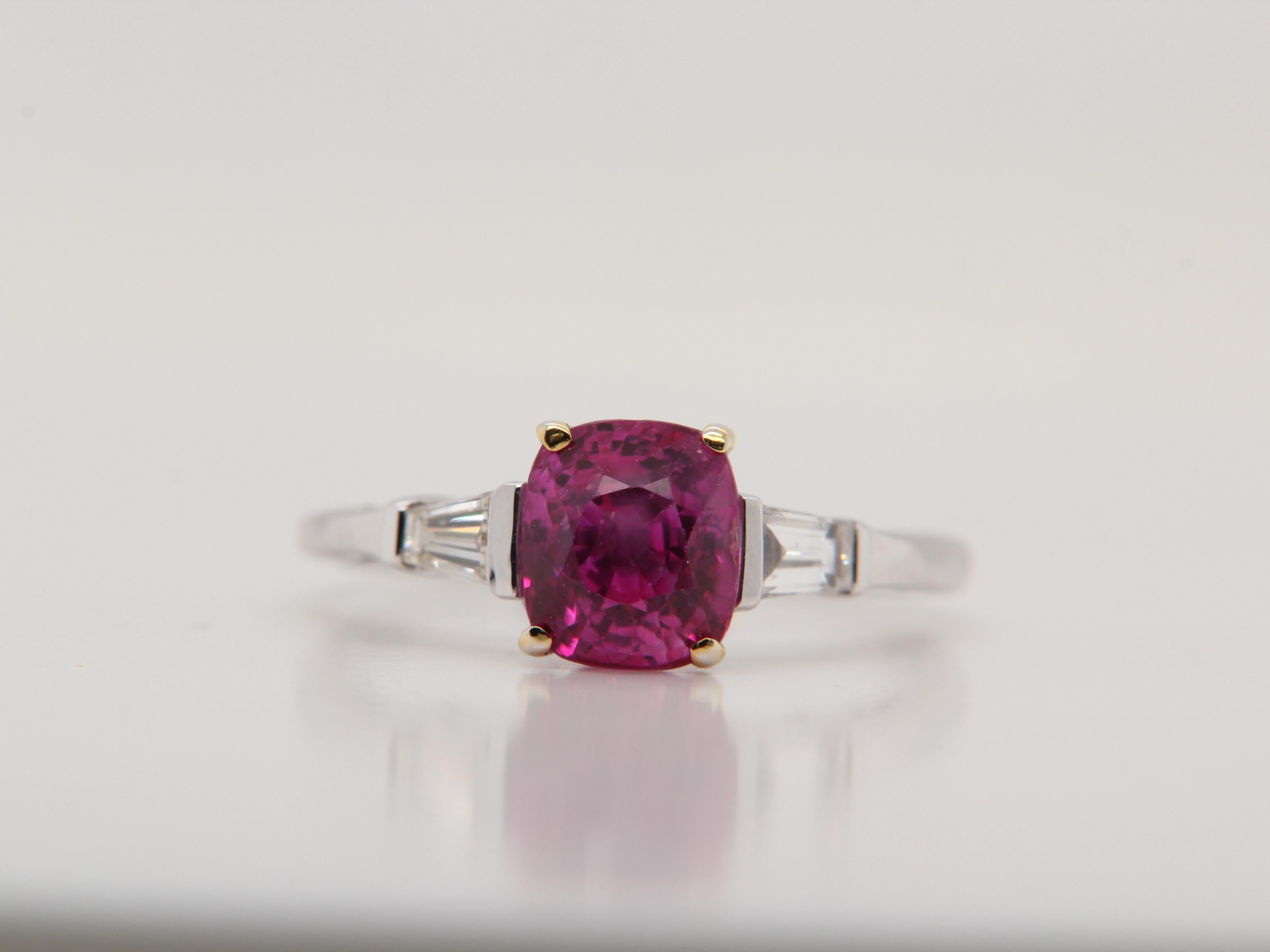 A new 2.30 carat Burmese ruby ring made in 18 Karat gold. The ruby is certified by Gem Research Swisslab (GRS) as natural, unheated, 'Pinkish-Red', and from the mine 'Mogok'. The total diamond weight is 2.01 carats and the total weight of the ring