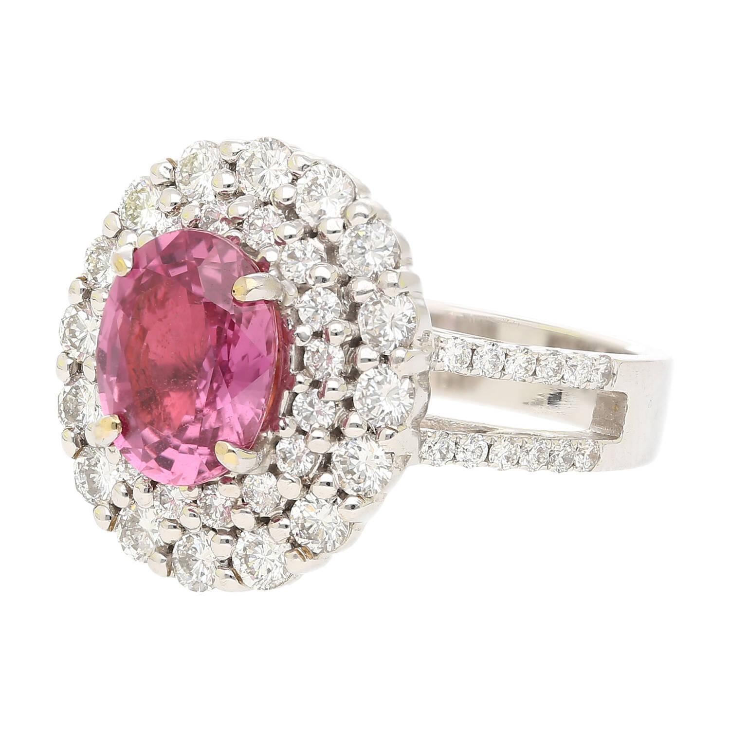 GRS Certified 2.33 Carat Pink Sapphire and Diamond Cocktail Ring in 18K White Gold. This stunning piece features a rare and exotic natural purplish / pink sapphire gemstone front-and-center originating from the island of Madagascar. The center stone