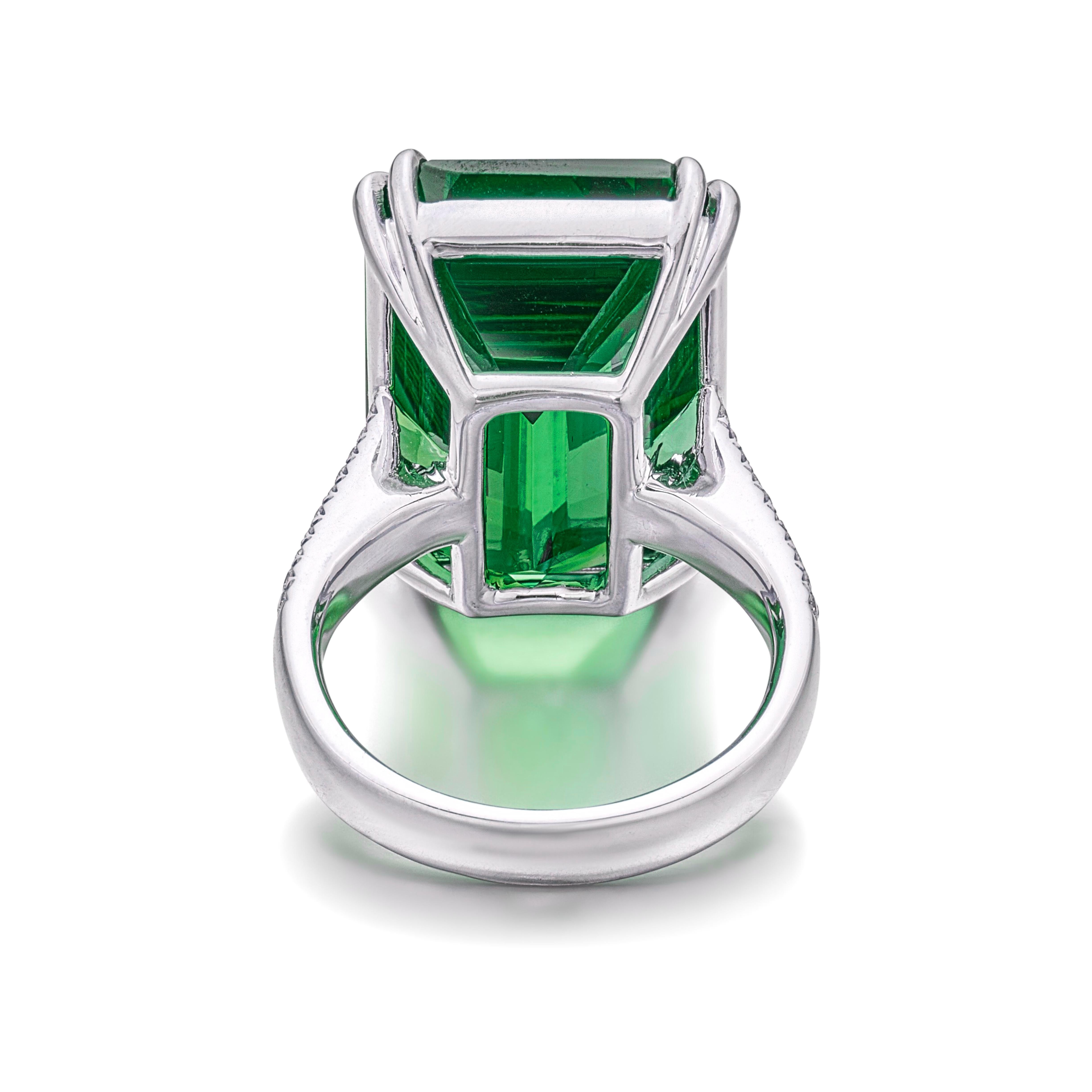 A timeless creation by Cecile Blake, this exquisite ring showcases a vibrant 22 carat natural Colombian emerald certified by GRS for its vivid green hue and untreated status. 

The Colombian emerald cut  is elegantly surrounded by a pave of