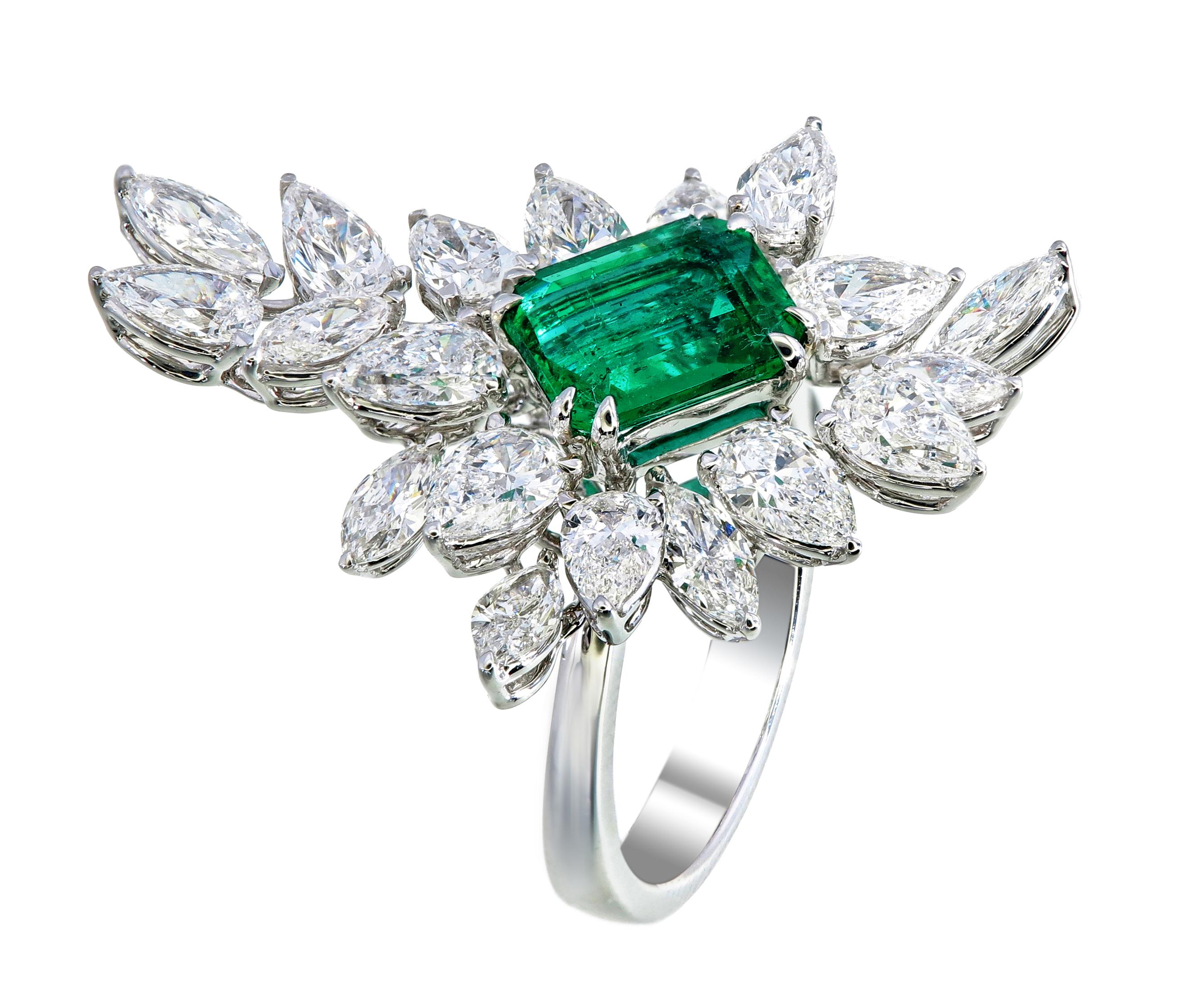 This exquisite emerald ring features a breathtaking Zambian emerald with insignificant oil treatment and a vivid green hue, weighing 2.40 carats. Certified by the renowned GemResearch Swisslab (GRS), this emerald showcases exceptional clarity and