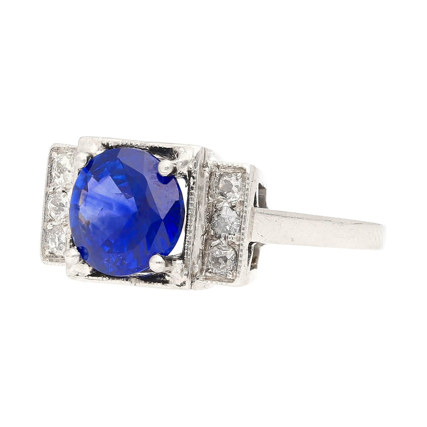 Platinum Set Art Deco Ring With 2.47 Carat Round Cut No Heat Vivid Royal Blue Sapphire and Round Diamond Side Stone.

Vintage Art Deco sapphire and diamond engagement ring, set in platinum 900. Centering a GRS-certified 