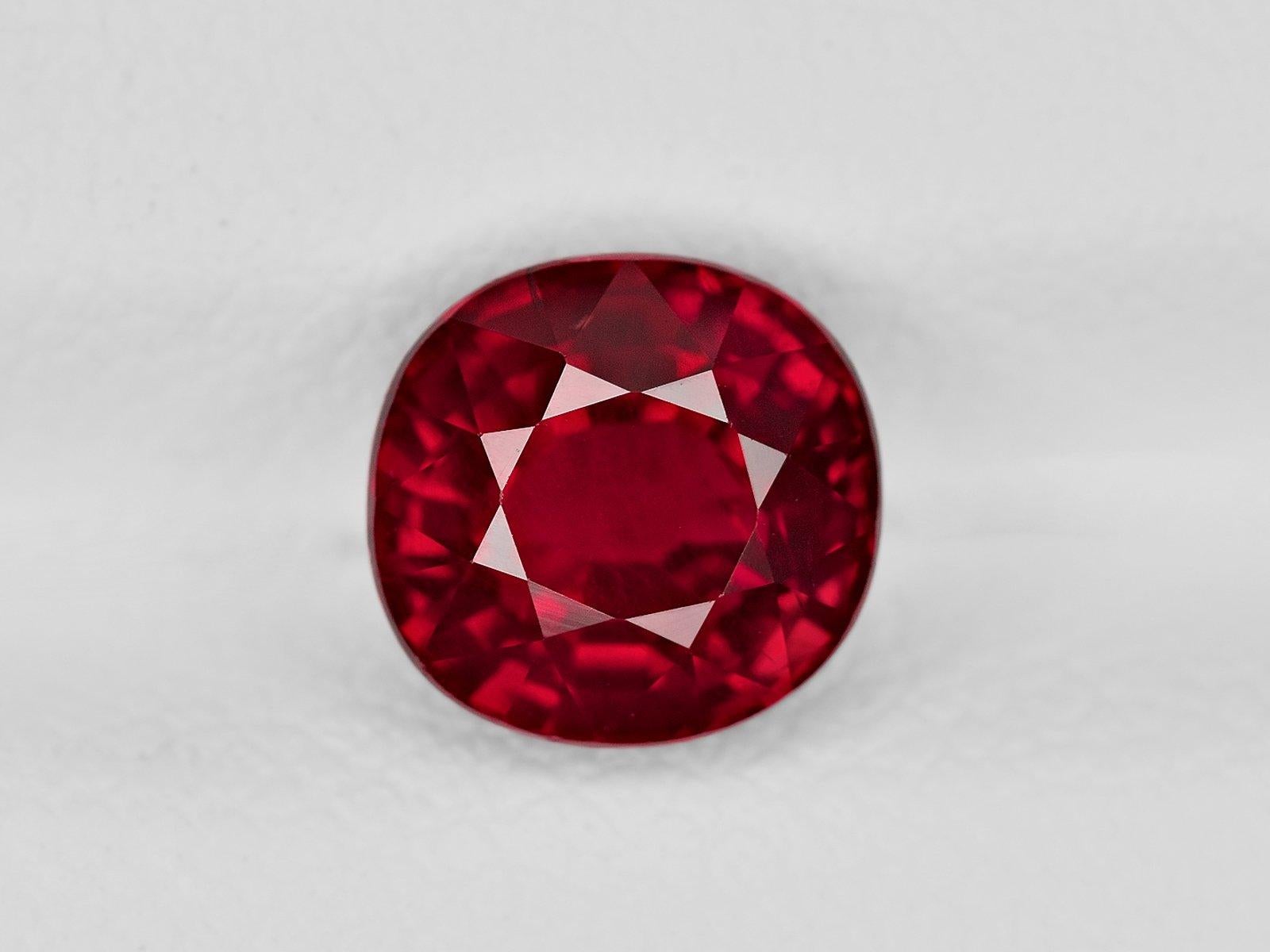 An exquisite peagon's blood deep red ruby set with two trillion cut diamonds d/e color vvs clarity

set in platinum



