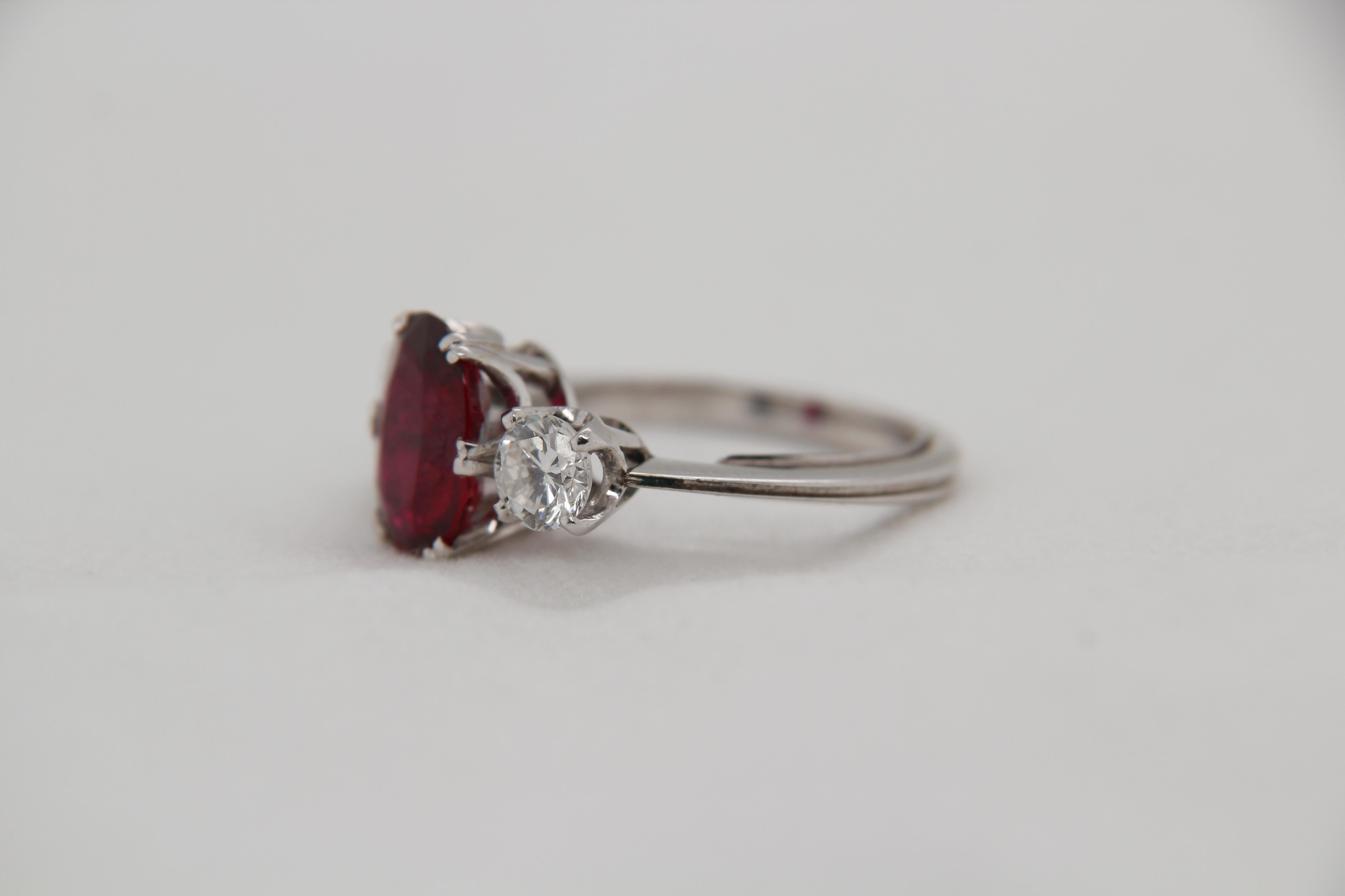 A new GRS certified 2.94 carat Thai Heated ruby ring mounted with diamonds in 18 Karat gold. The ruby weighs 2.94 carat and is certified by Gem Research Swisslab (GRS) as natural, heated. The total diamond weight is 1.00 carat and the total rings
