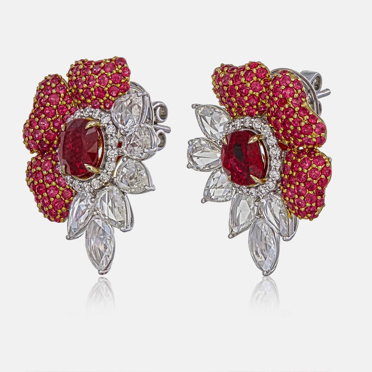 These earrings feature GRS-certified Pigeon Blood rubies, totaling 3.16 carats, with one ruby weighing 1.66 carats (Certificate # GRS2022-051915) and the other 1.50 carats (Certificate # GRS2022-052493). 

Known for their vivid and intense red hues,