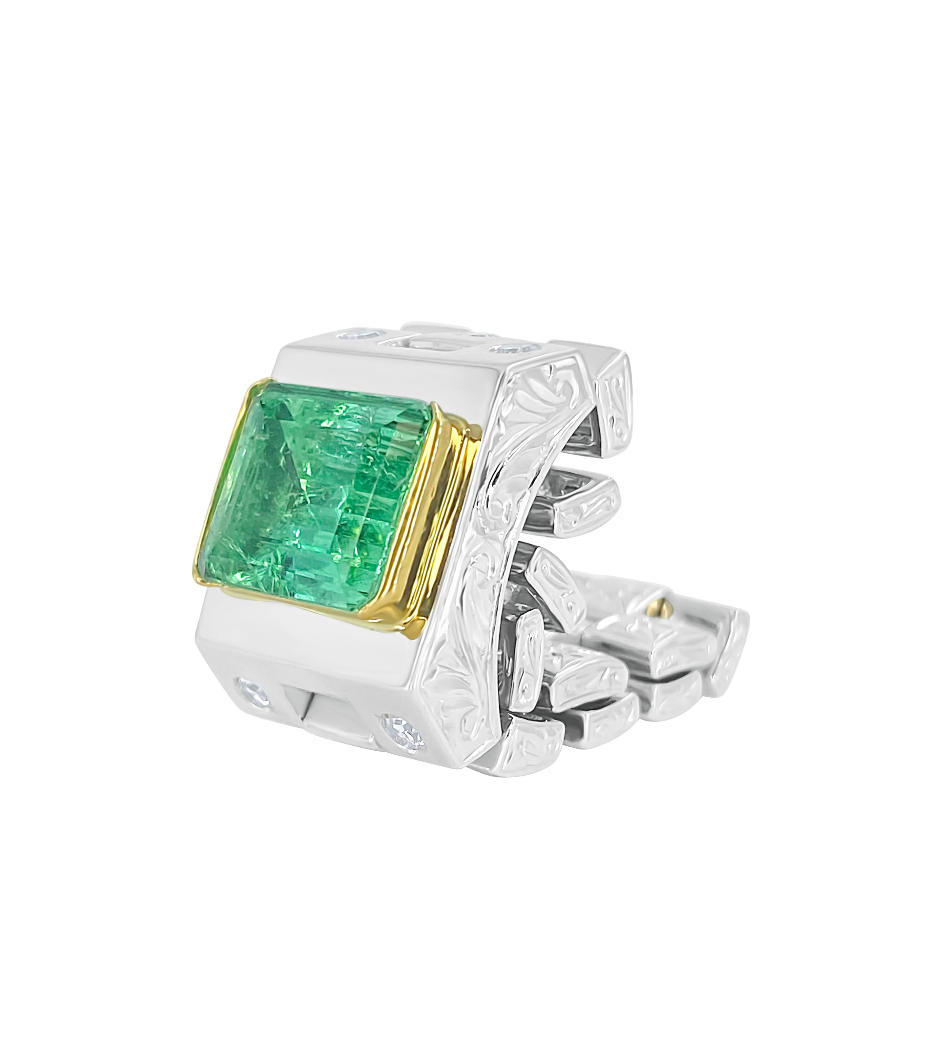 Available in size 7.5 and size 9

GRS certified natural Colombian Emerald mounted in an 18k gold and platinum link ring setting. This legendary Emerald is of Colombian origin and has the lowest degree of treatment (insignificant)*. The Emerald has