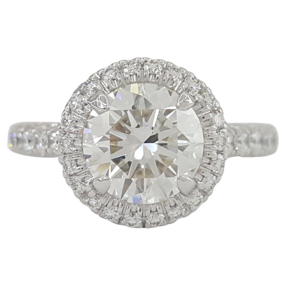 An exquisite CARTIER solitaire round brilliant cut diamond with a halo and pave 

comes with original jewel box and GIA report
