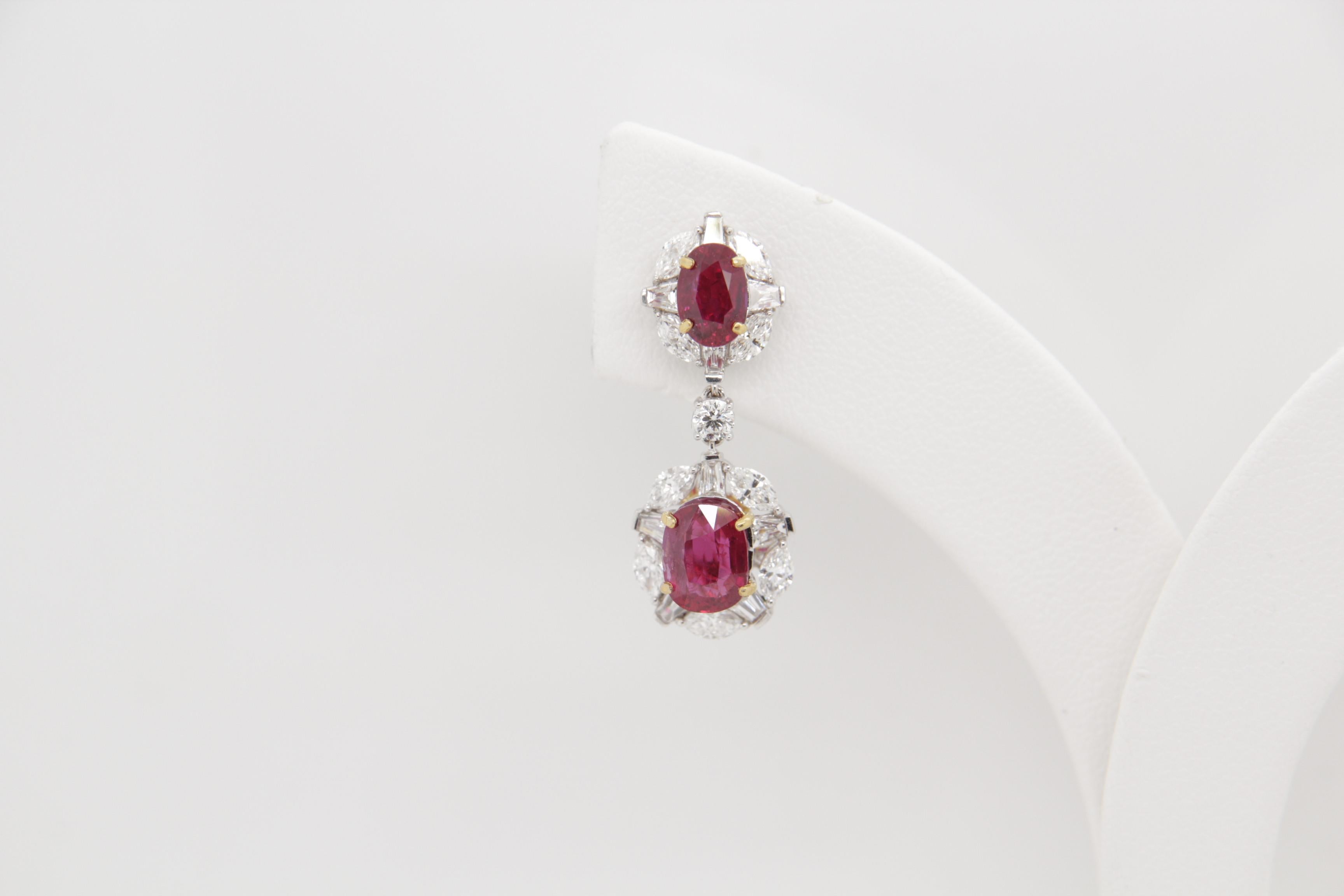 An eye catching pair of vibrant and rare Burmese ruby and diamond earrings. The ruby's shining lustre is complimented by the sparkling diamonds, this showcases the elegance of the piece . This rare piece will not only help to exude confidence and