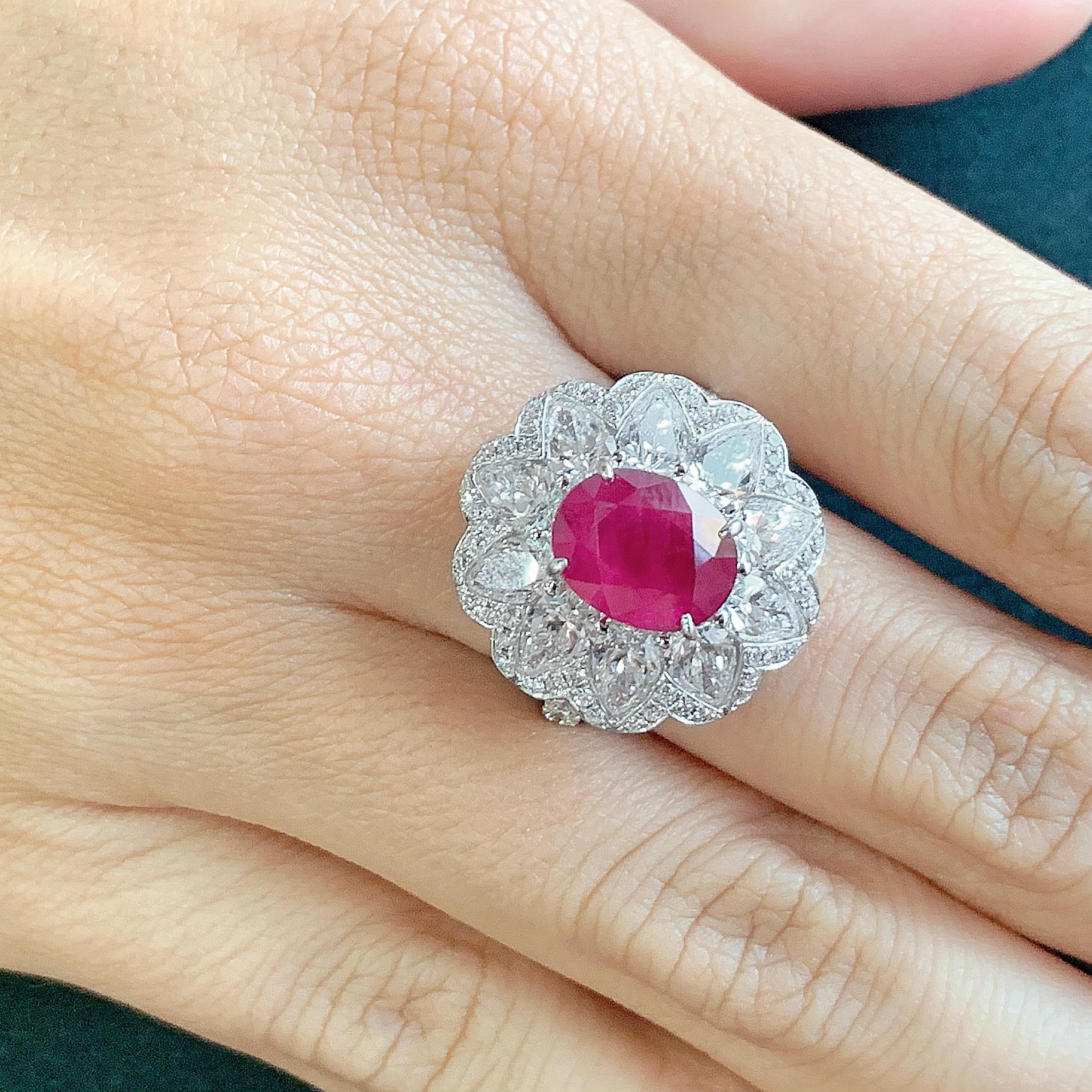 Centered with a magnificent 3.80 carat GRS certified oval-cut Burma ruby, Butani's 18-karat white gold cocktail ring is encrusted with 3.81 carats of glistening white diamonds in a floral silhouette.  It would make a thoughtful gift for someone with