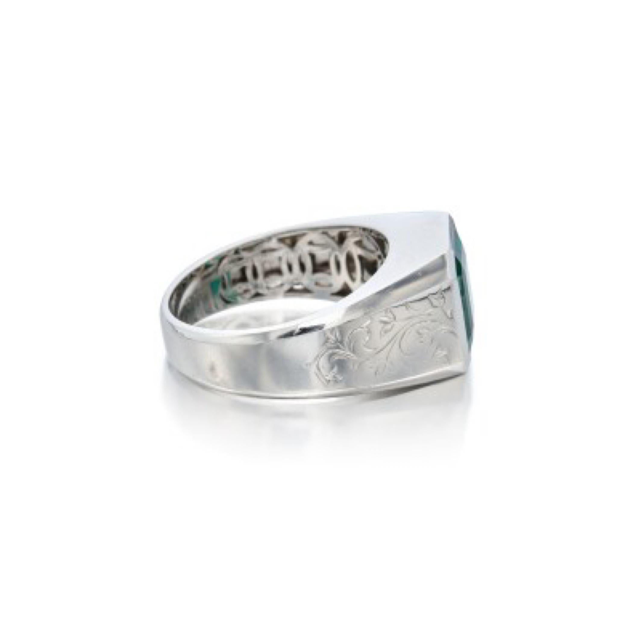Featuring an octagonal step-cut emerald. Interior of shank stamped Au750 for 18 karat (white) gold. The emerald is Vivid green, moderately included, with a cavity on the crown. Accompanied by GRS report no. 023044 dated August 4, 2016 stating that
