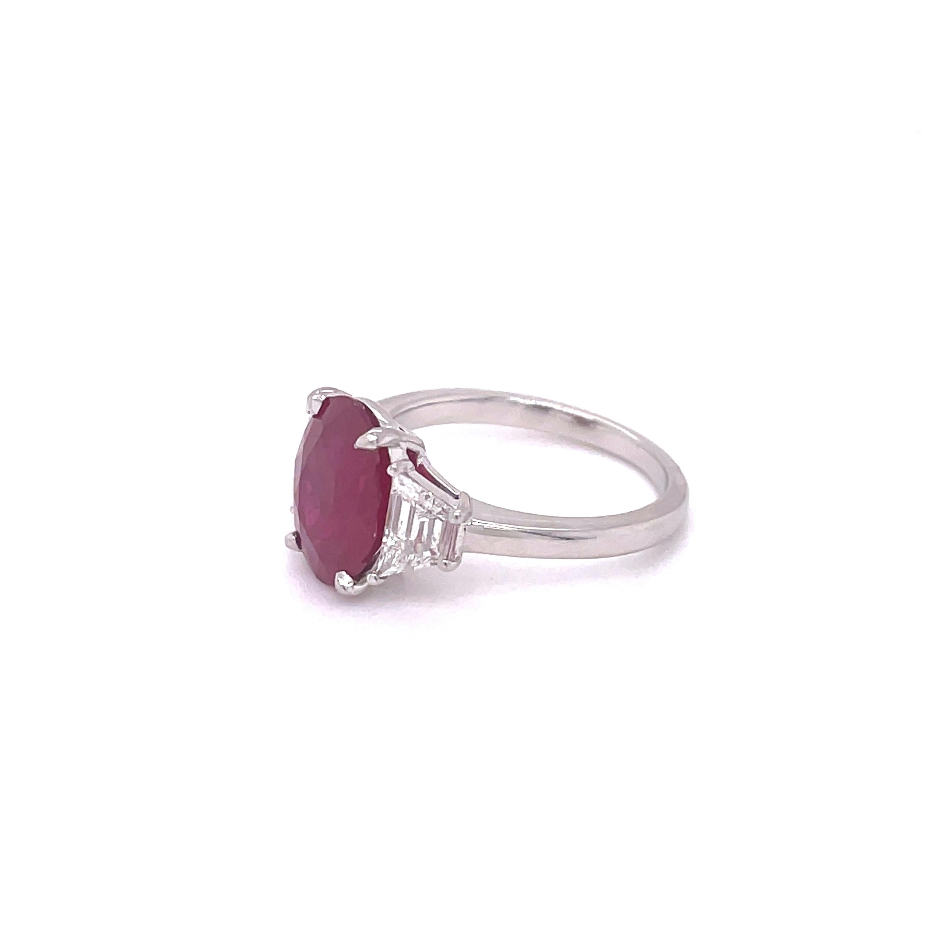3.83ct Oval Burma Ruby set in Platinum 
with 2 side trapezoid diamonds = 0.56cttw
GRS #2015-042465
