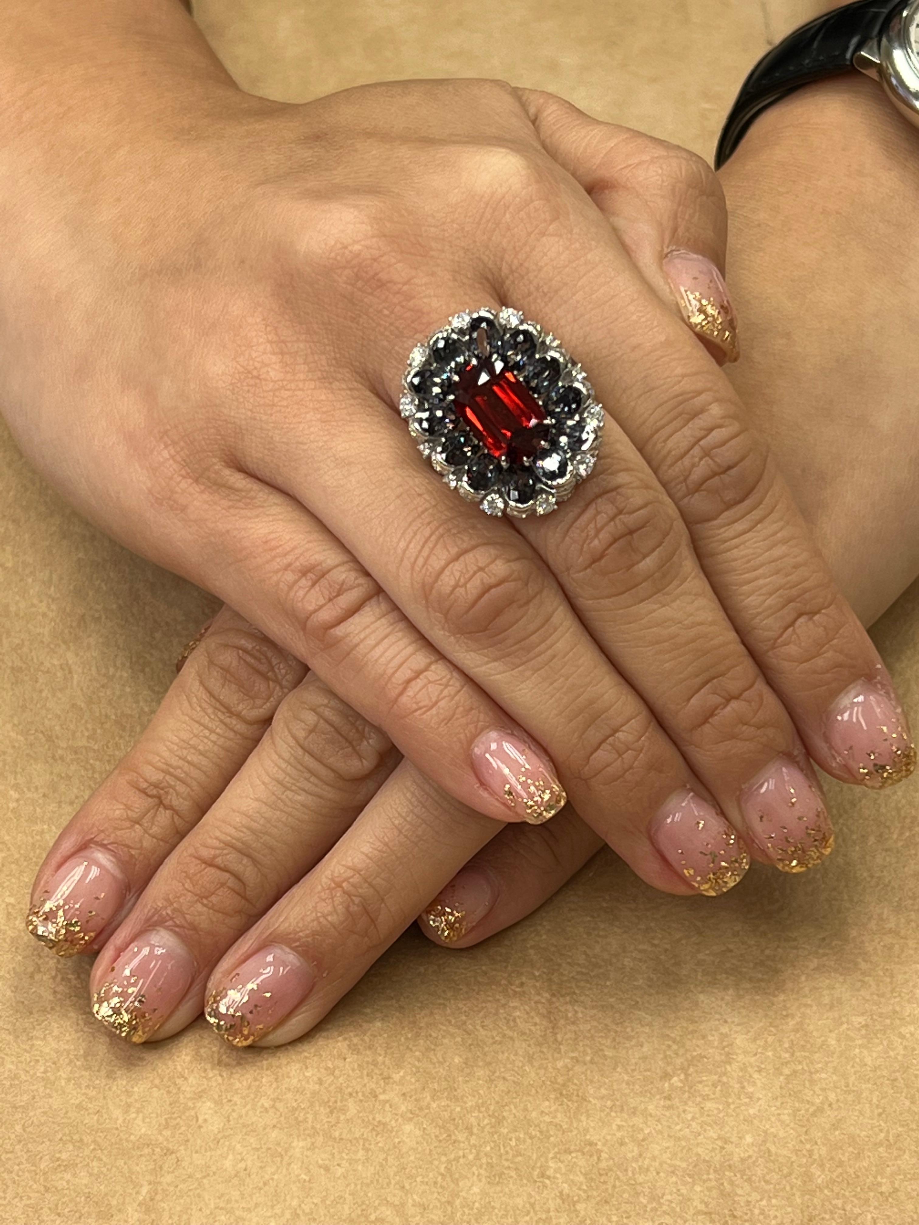 Please check out the HD video! A big statement ring. This spinel is certified by GRS with no heat or or any treatment. The oversized Spinel (4.30 cts) has a very unusual reddish-orange color. Furthermore, it is matched with 12.036 cts of natural