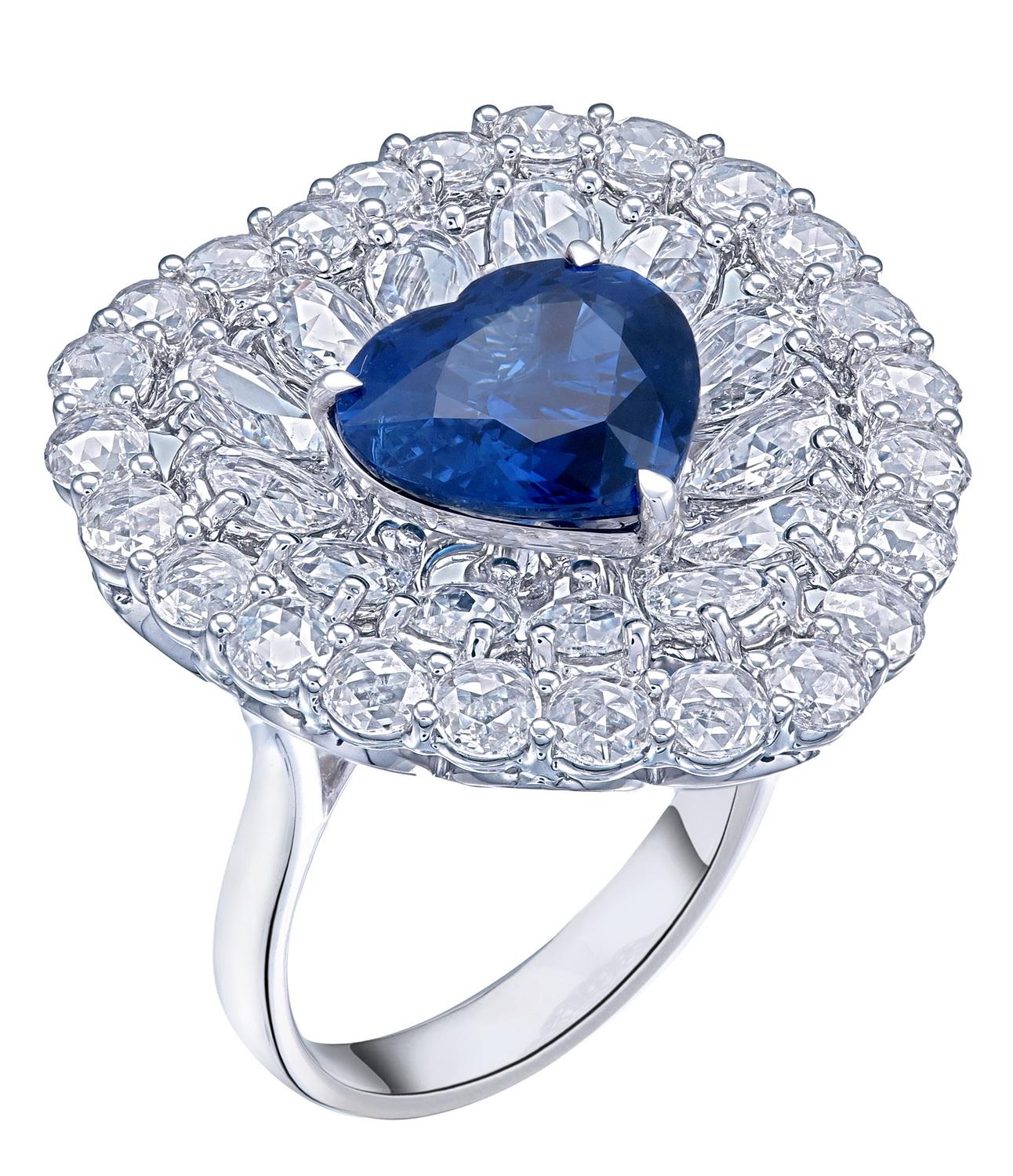 This elegant ring features a GRS-certified 4.32-carat vivid blue Ceylon sapphire, renowned for its exceptional color and clarity. The sapphire’s captivating heart shape is prominently displayed, adding a distinctive and romantic touch to the