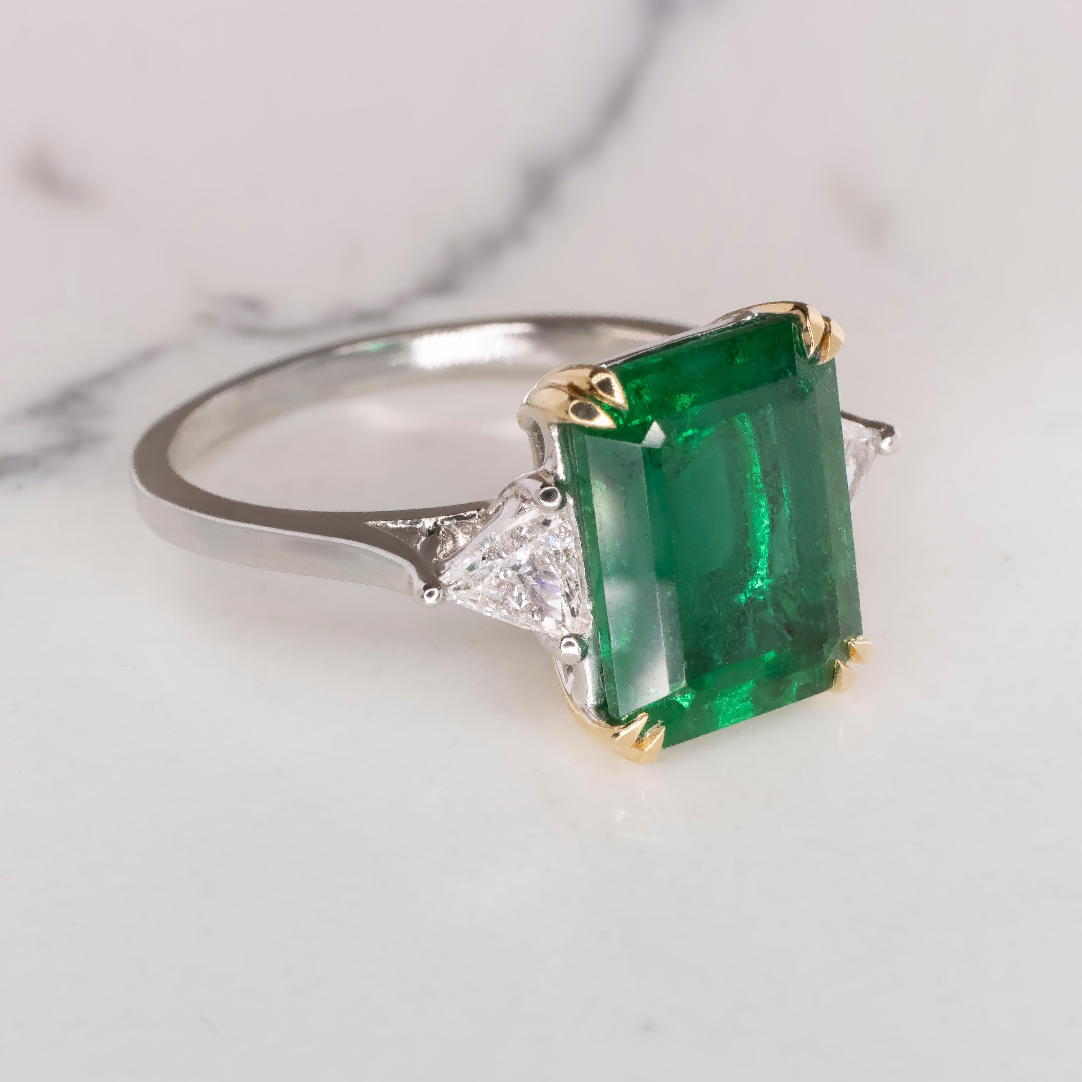 Indulge in the opulence of this masterfully crafted ring from Antinori di Sanpietro. 

At the heart of this stunning piece lies a GRS certified, 4.38ct emerald-cut green emerald, cherished for its natural allure and a minimal oil enhancement,