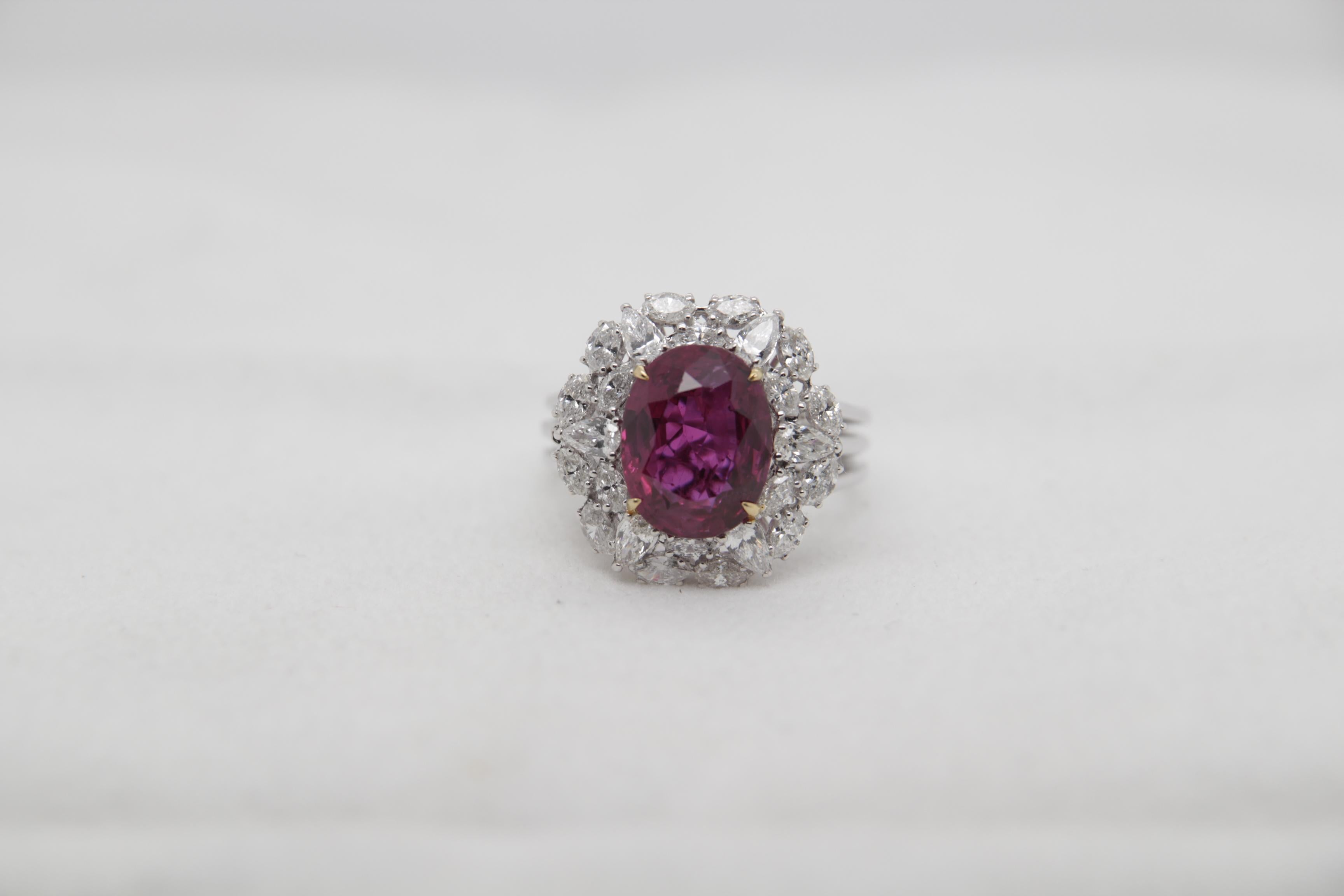 A brand new thai ruby and diamond ring in 18 karat gold. The total thai ruby weight is 4.61 carats and is certified by Gem Research Swisslab (GRS) as natural, 'no heat' and 'red'. The total diamond weight is 1.33 carats and total ring weight is 9.10