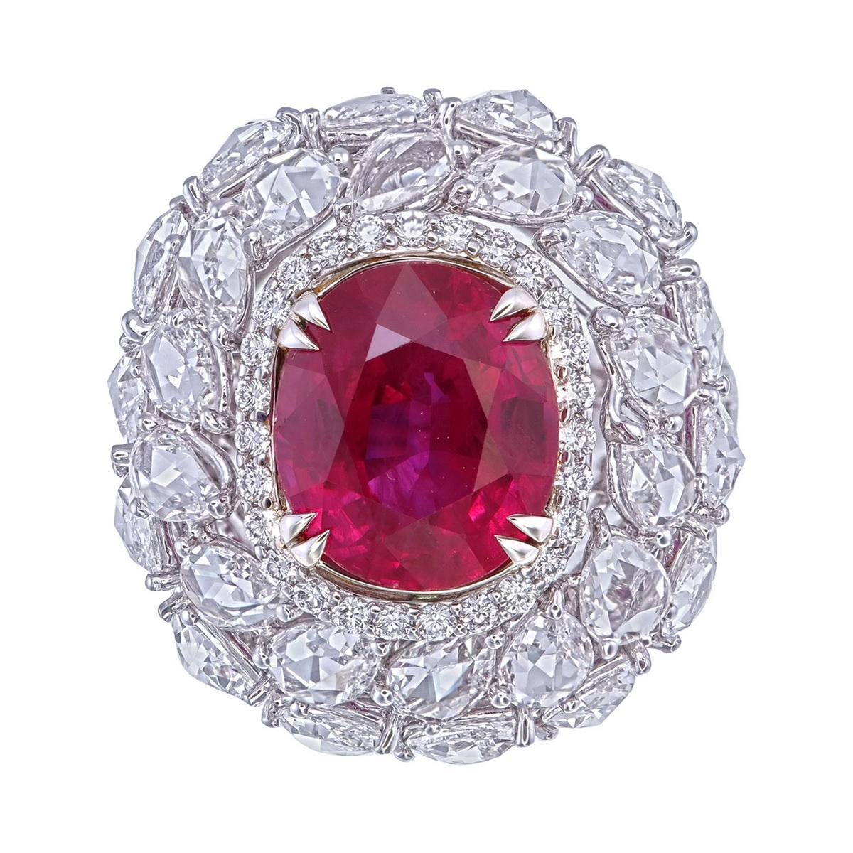 This stunning ring features a GRS-certified 5.04-carat Burma ruby, renowned for its deep, rich red color and exceptional quality. The ruby’s striking shape and vivid hue are magnificently showcased, highlighting its natural beauty.

Enhancing the