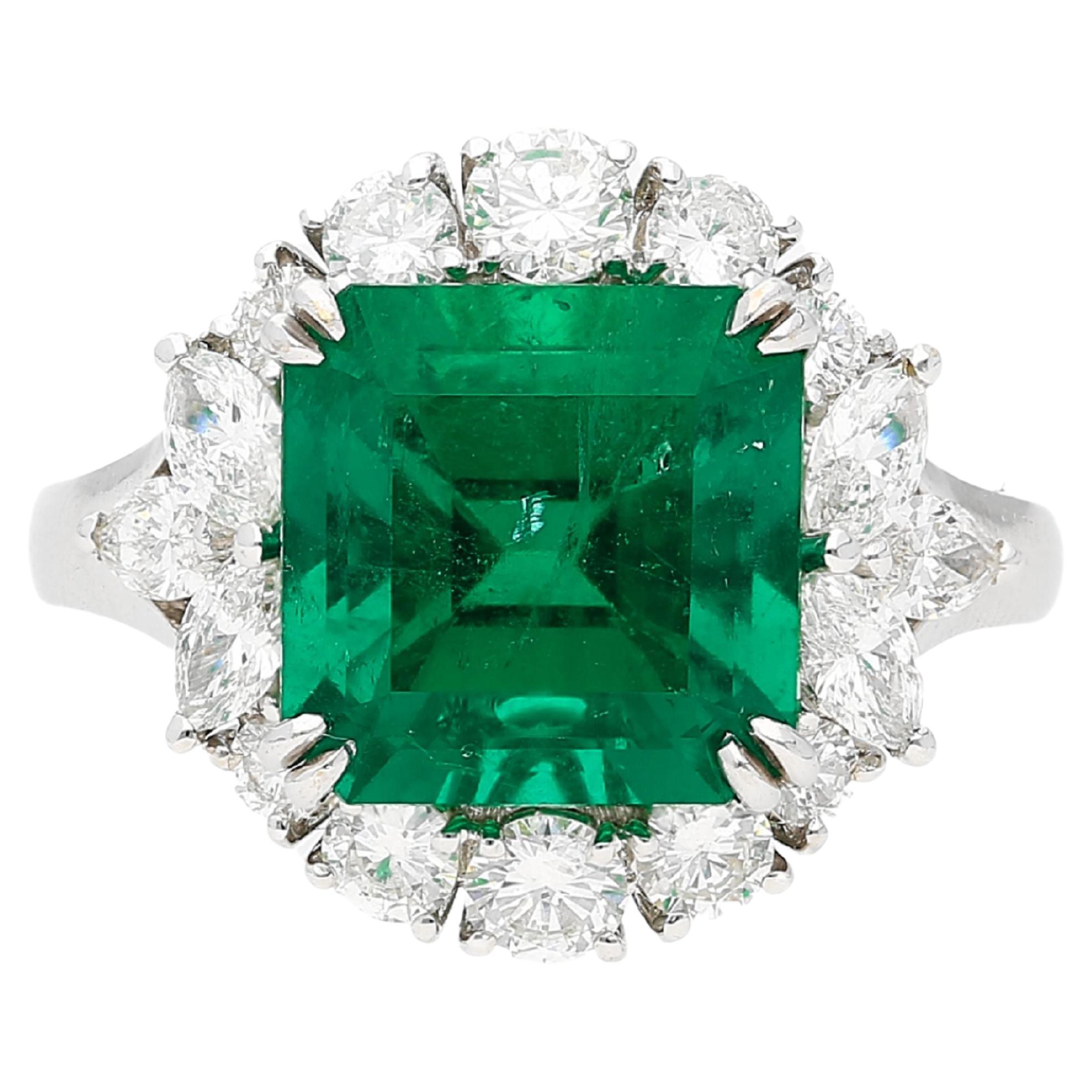 GRS Certified 5.20 Carat Minor Oil Colombian Emerald and Diamond Halo Ring For Sale