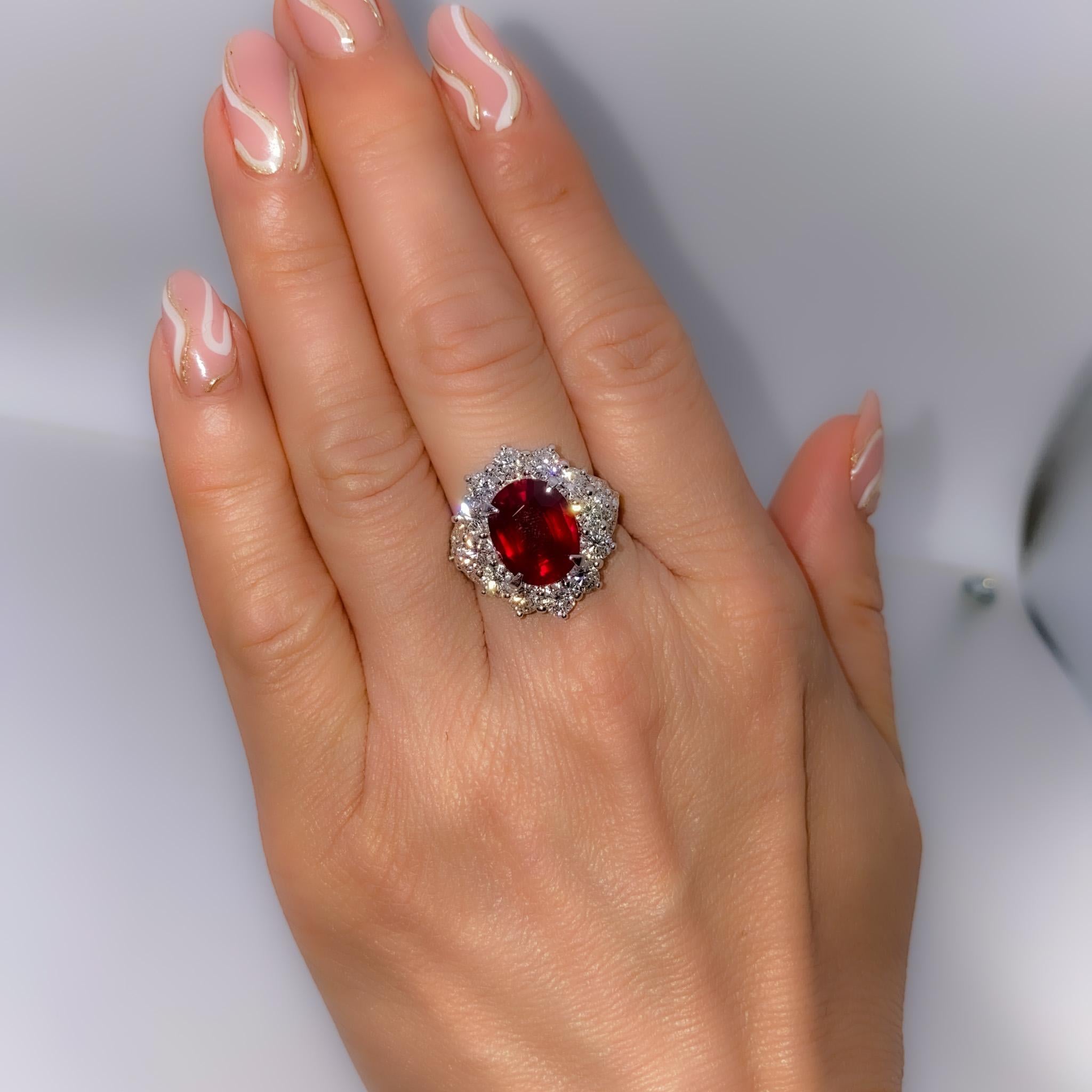 A beautiful 5.24-carat Unheated Vivid Red ruby from Mozambique is set along with 2.67 carats of diamonds in this PT ring. Ever classical and a great investment piece, this piece is a head-turner. This piece will come with a GRS report