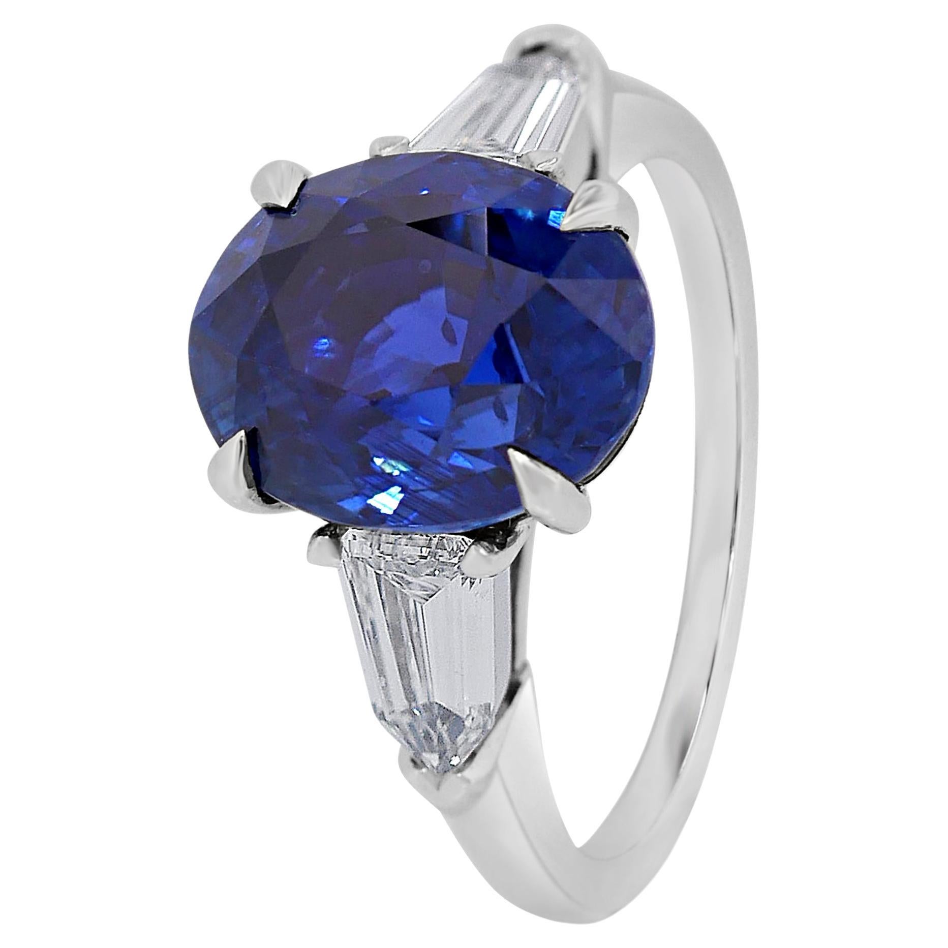 GRS Certified 5.29 Carats Royal Blue Sapphire Three Stone Ring in Platinum For Sale