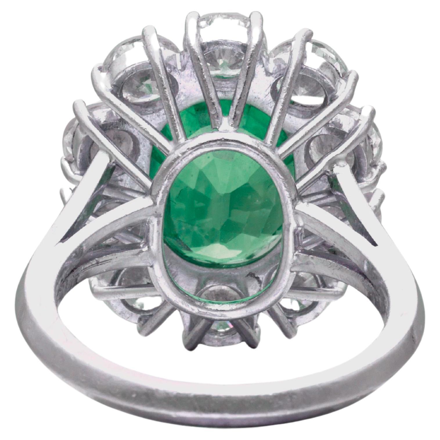 Introducing a truly extraordinary piece of fine jewelry: the GRS Certified 5.57 Carat vivid green emerald diamond Ring.

Immerse yourself in the captivating allure of this exquisite ring, featuring a stunning 5.57 carat vivid green emerald of